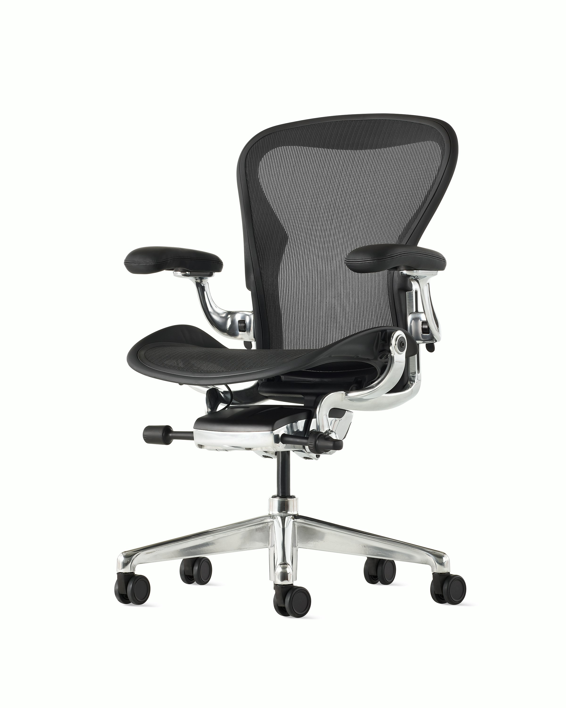 Black matte Aeron Chair on a white background with a polished aluminum 5-star base, chassis, and ergonomic back support, angle view of chair front.