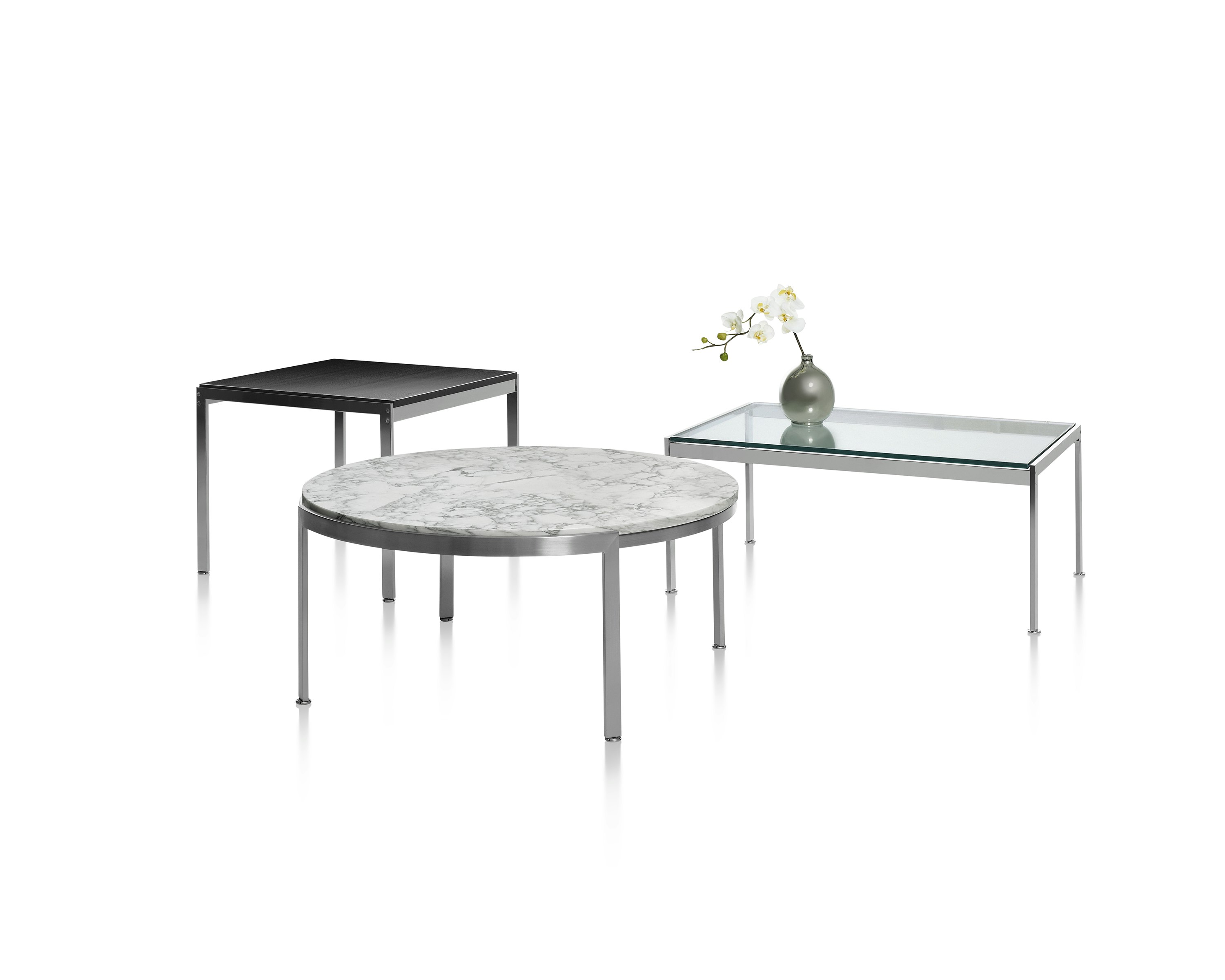 Partial view of a rectangular Metal Series coffee table with a glass top.