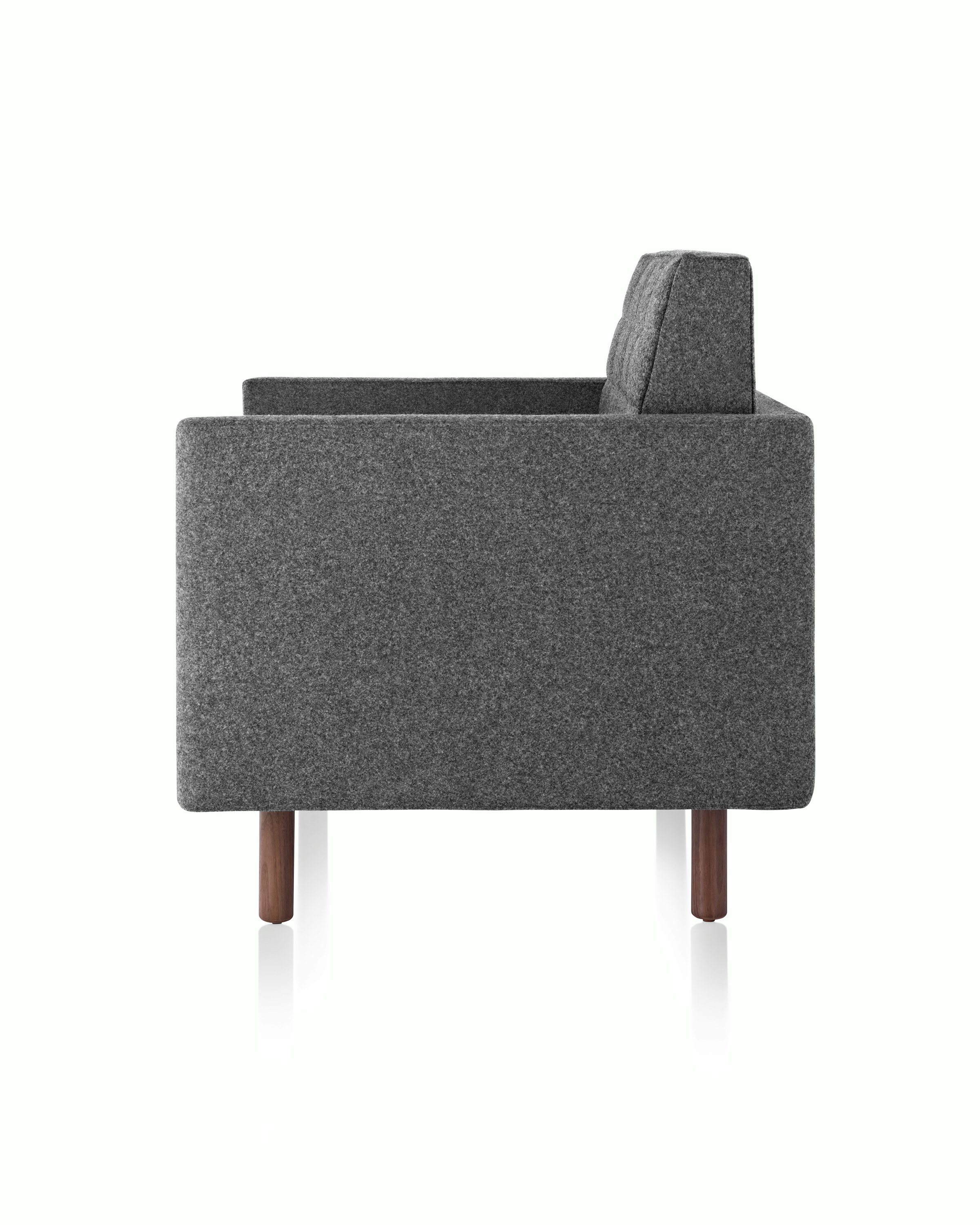 Side view of a Tuxedo Classic club chair upholstered in dark gray fabric.