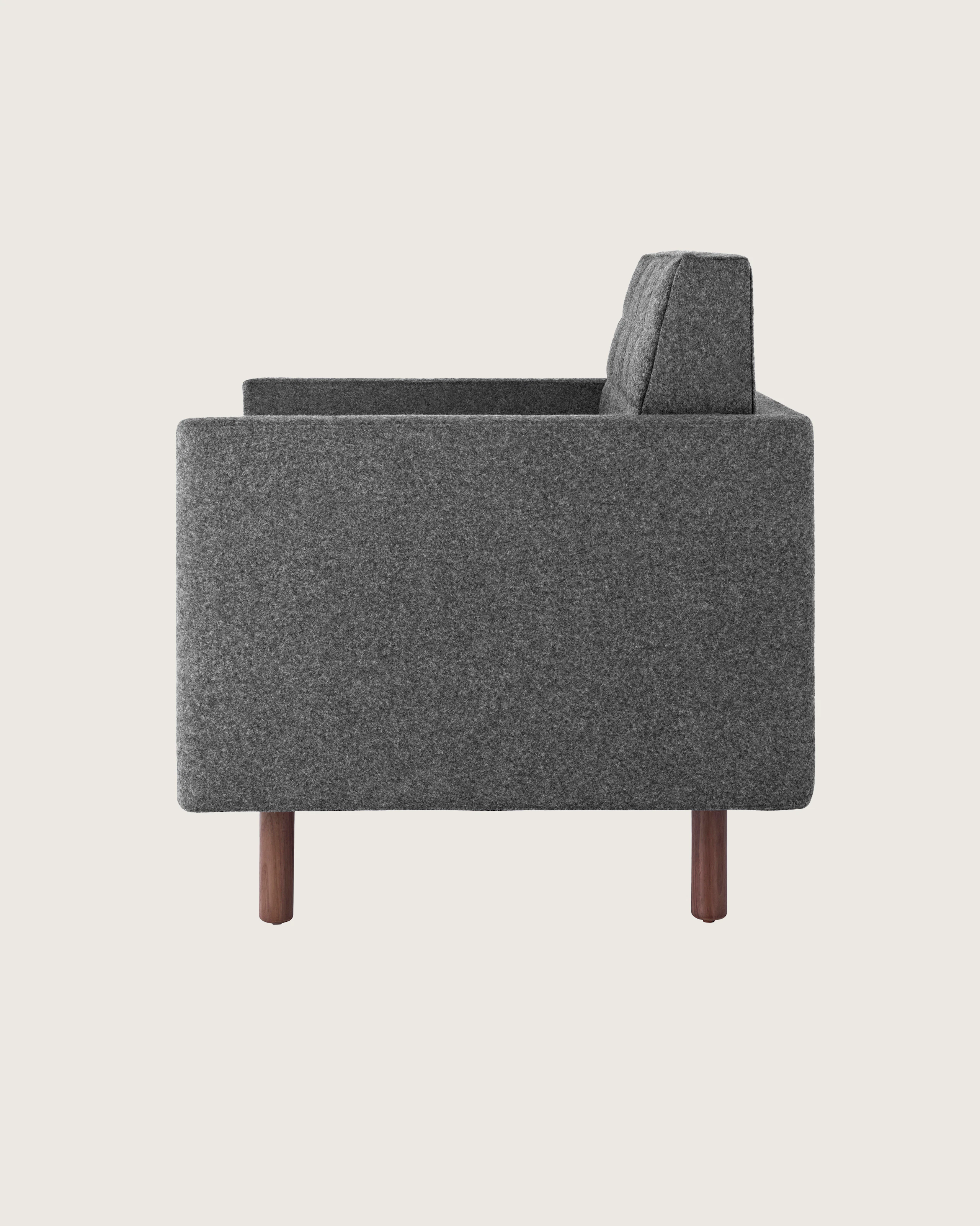 Side view of a Tuxedo Classic club chair upholstered in dark gray fabric.