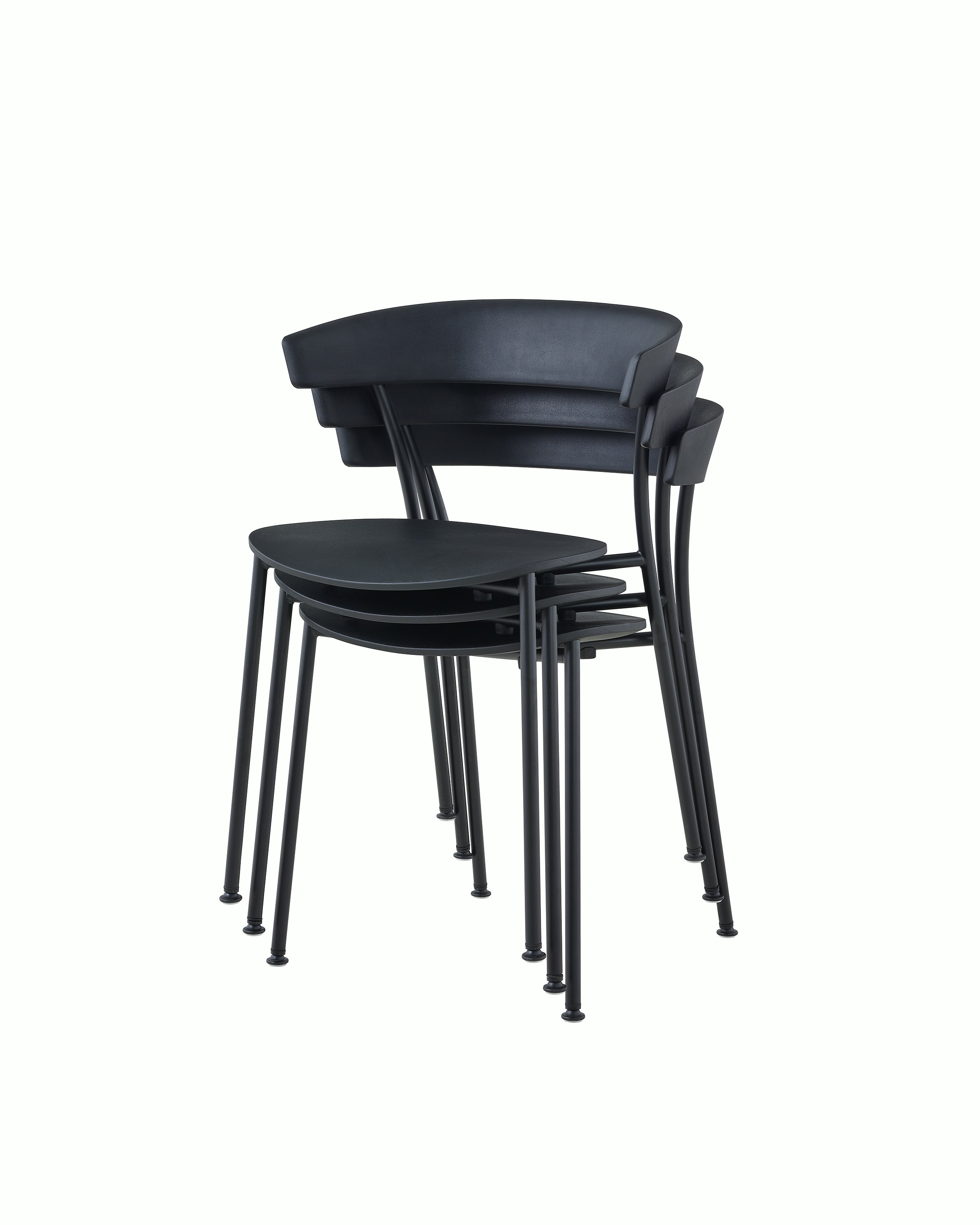 A three-quarter angle view of black Leeway Chairs stacked three high.