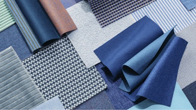 A close-up of a stack of colorful fabric with varying patterns.