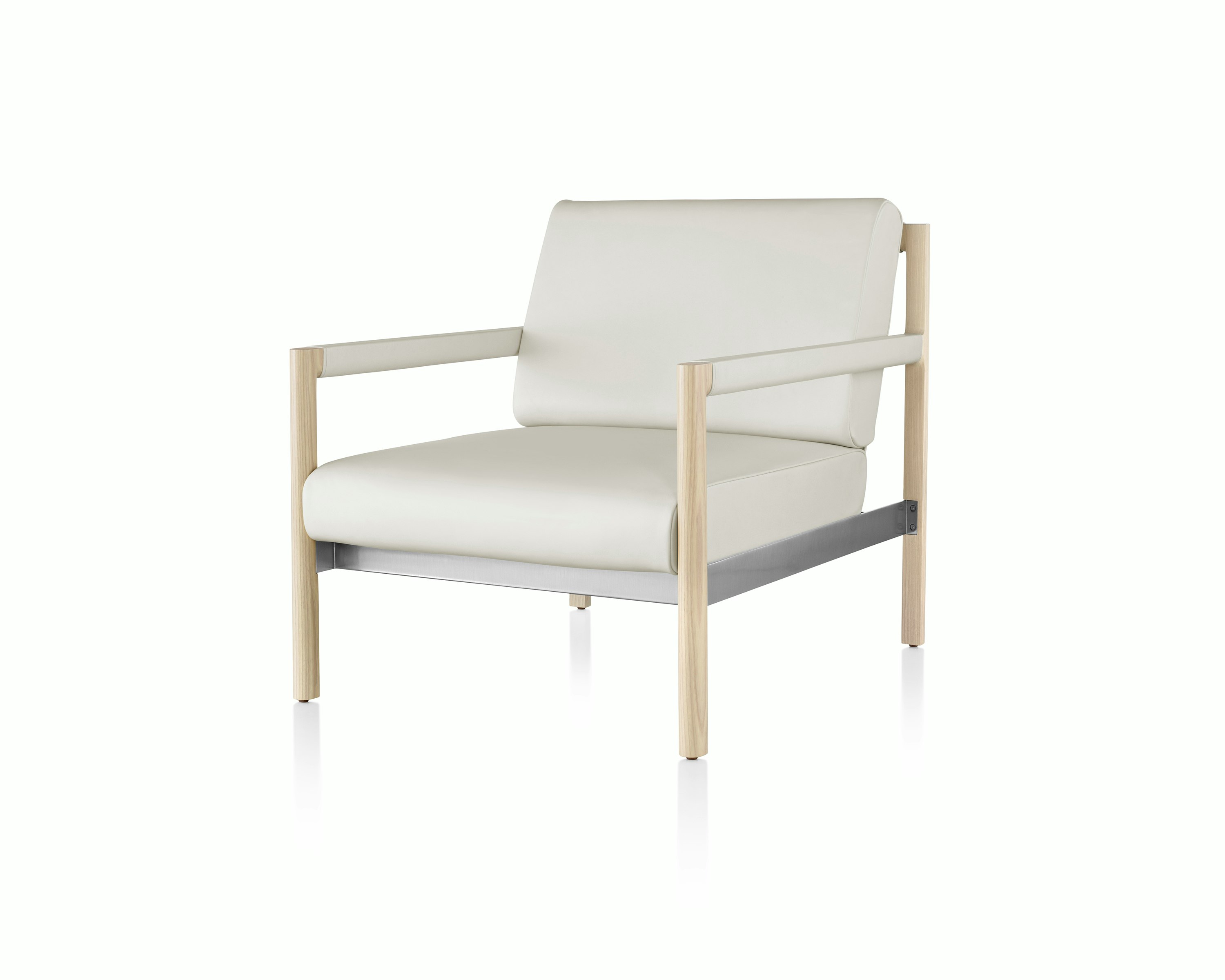 Angled view of a Brabo club chair with off-white leather upholstery, leather and metal accents, and an exposed wood frame.