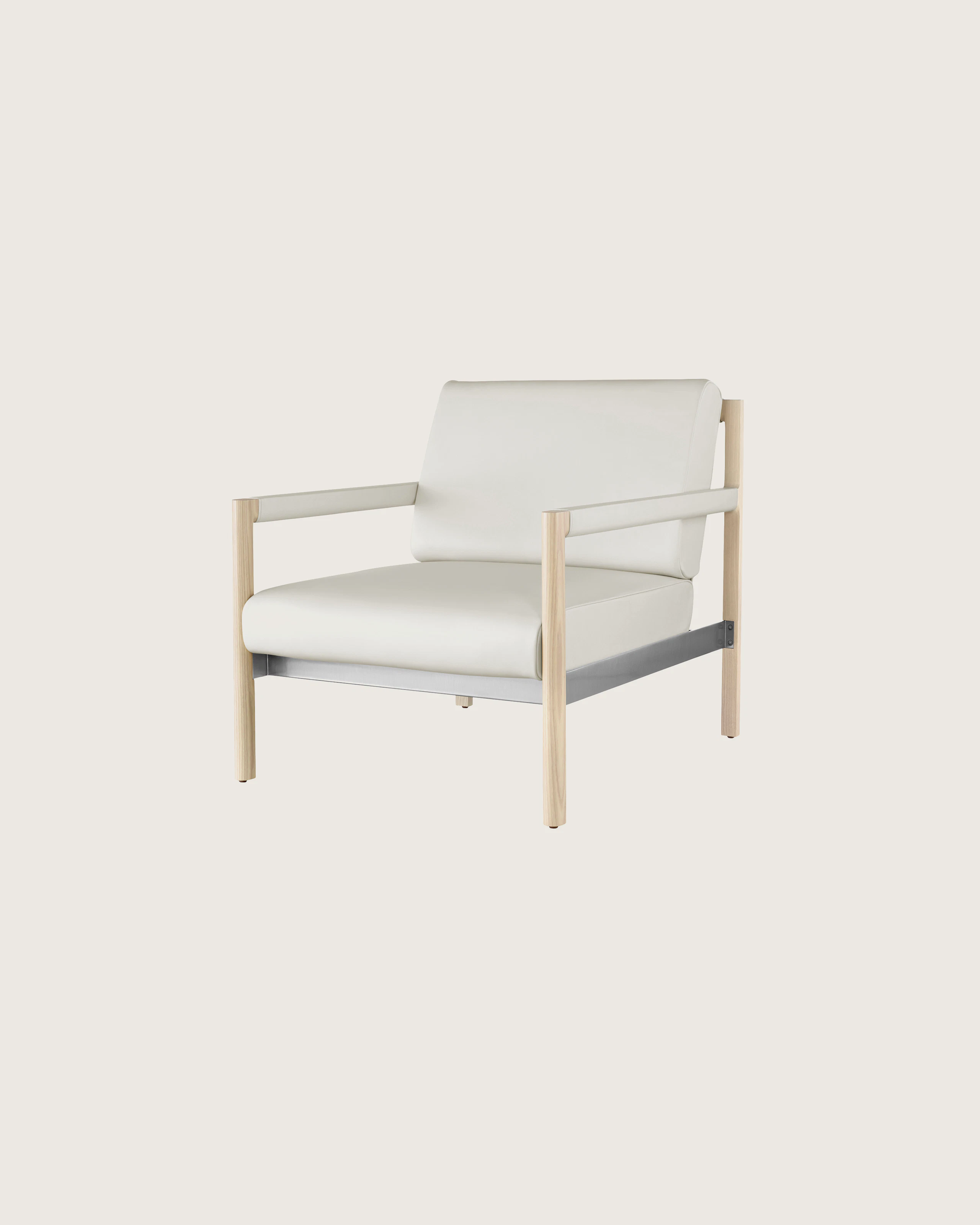 Angled view of a Brabo club chair with off-white leather upholstery, leather and metal accents, and an exposed wood frame.