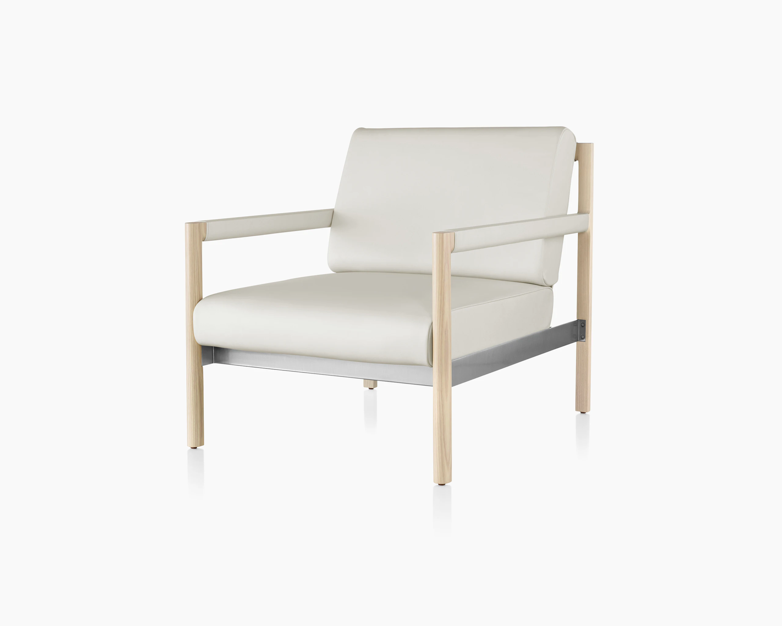Angled view of a Brabo club chair with off-white leather upholstery, leather and metal accents, and an exposed wood frame.