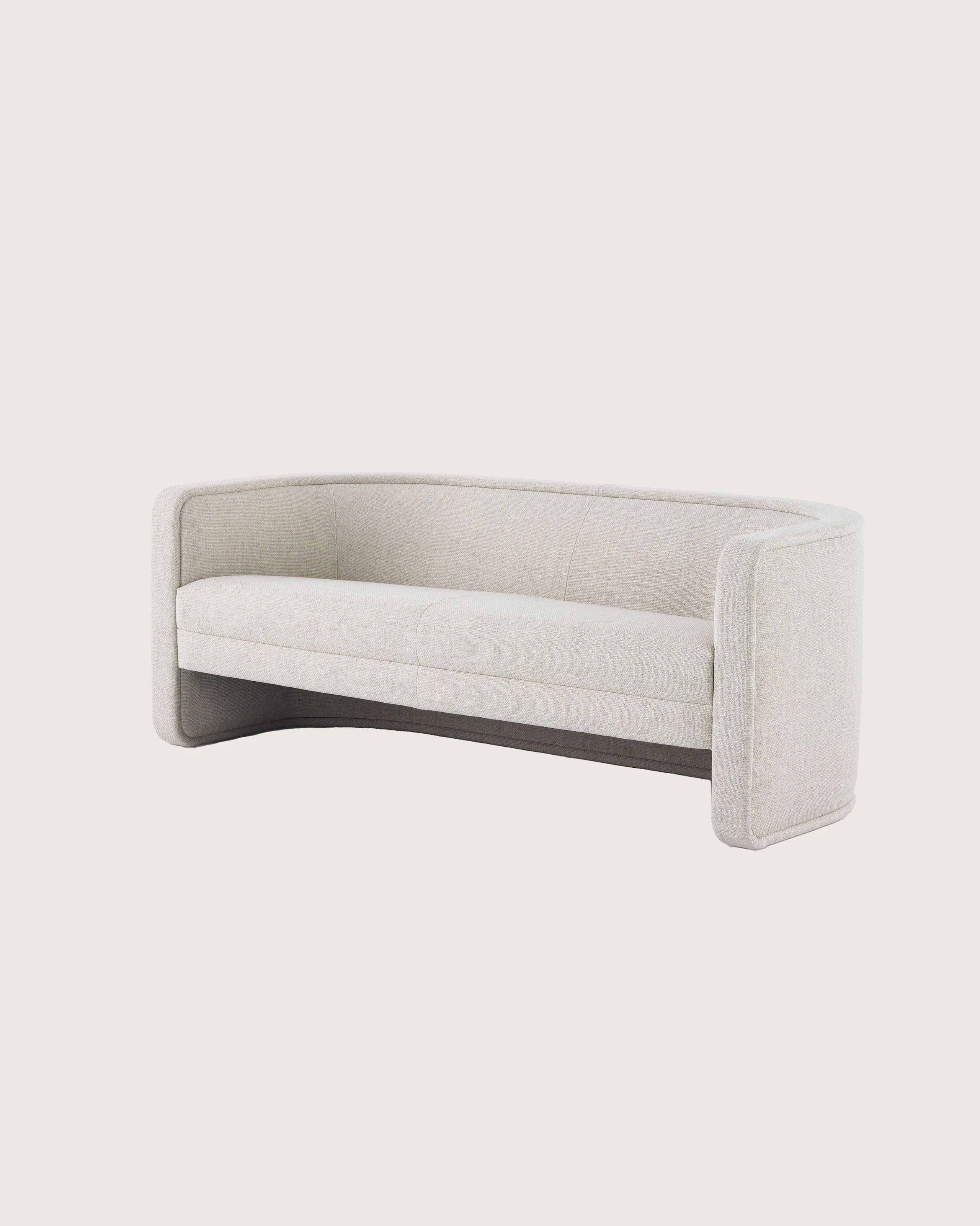A U-Series Settee upholstered in a light neutral fabric.