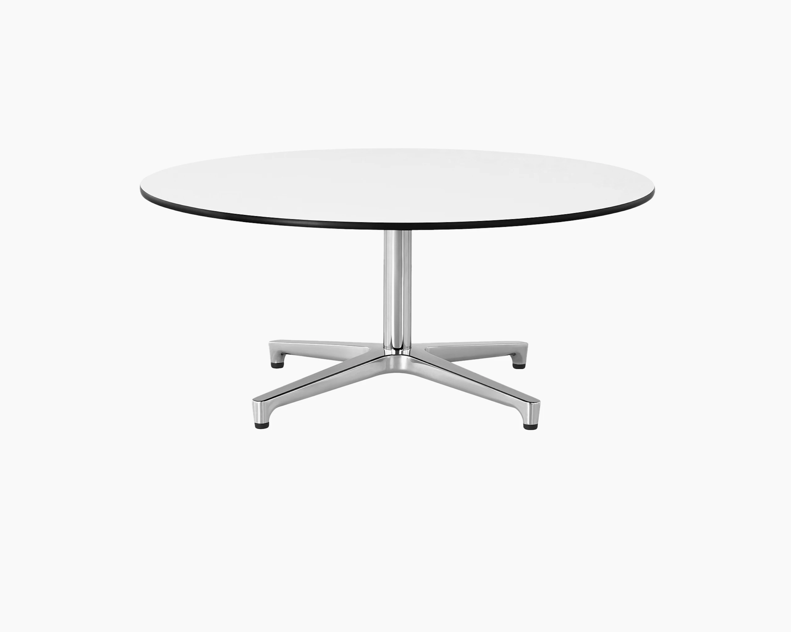 The upper portion of a round Saiba occasional table, showing the white back-painted glass top.