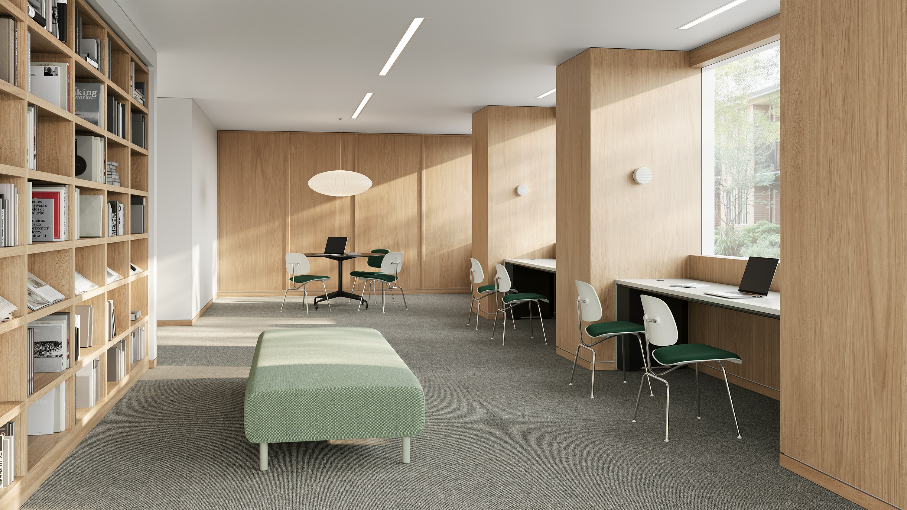 Library with oak bookshelves and green upholstered Eames EC-127