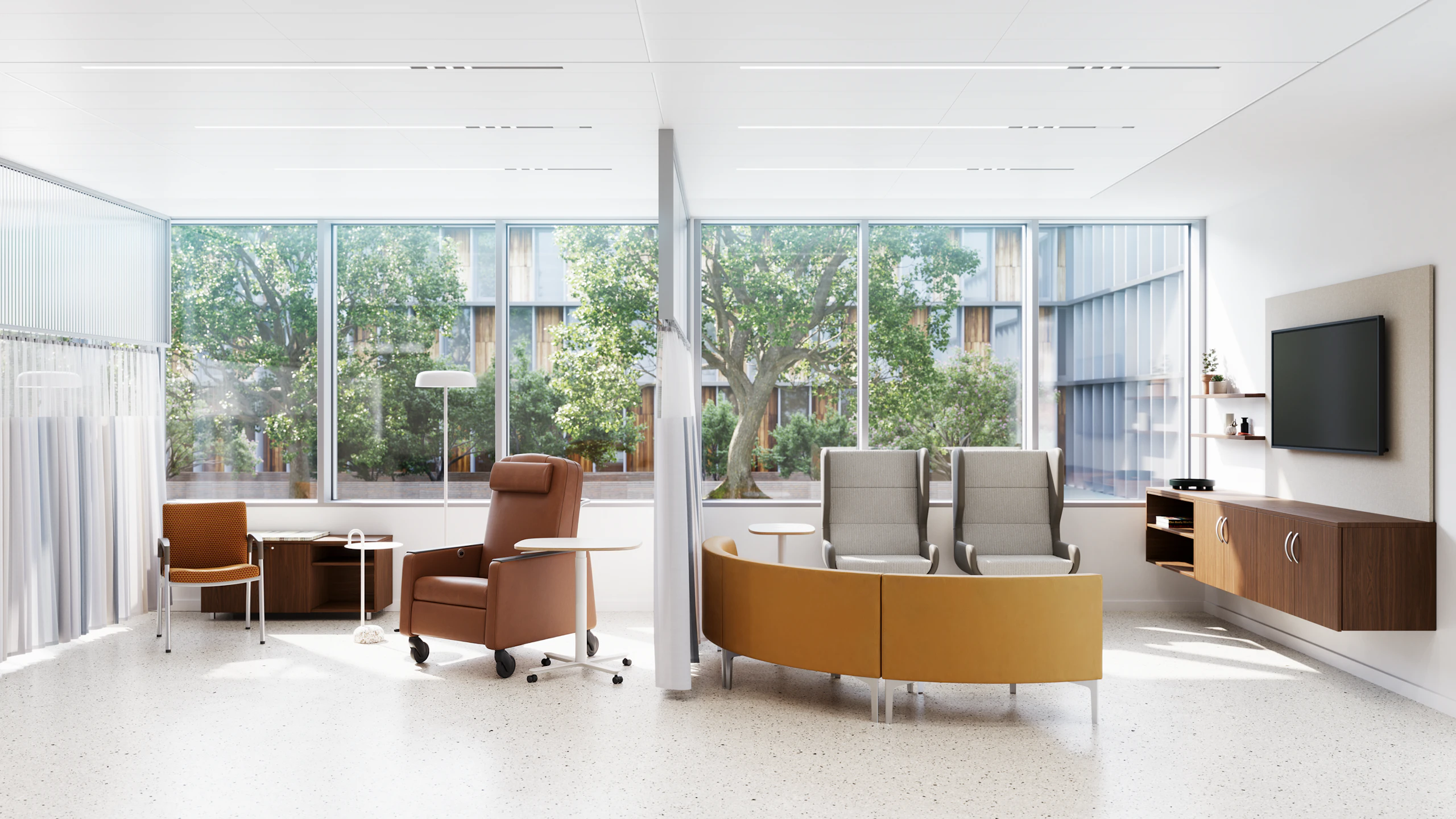 Outpatient waiting area, furnished with a red Herman Miller Gemma Recliner, Nemschoff Valor Side Chair, and other furniture from the MillerKnoll portfolio, overlooking an outdoor space filled with green foliage.