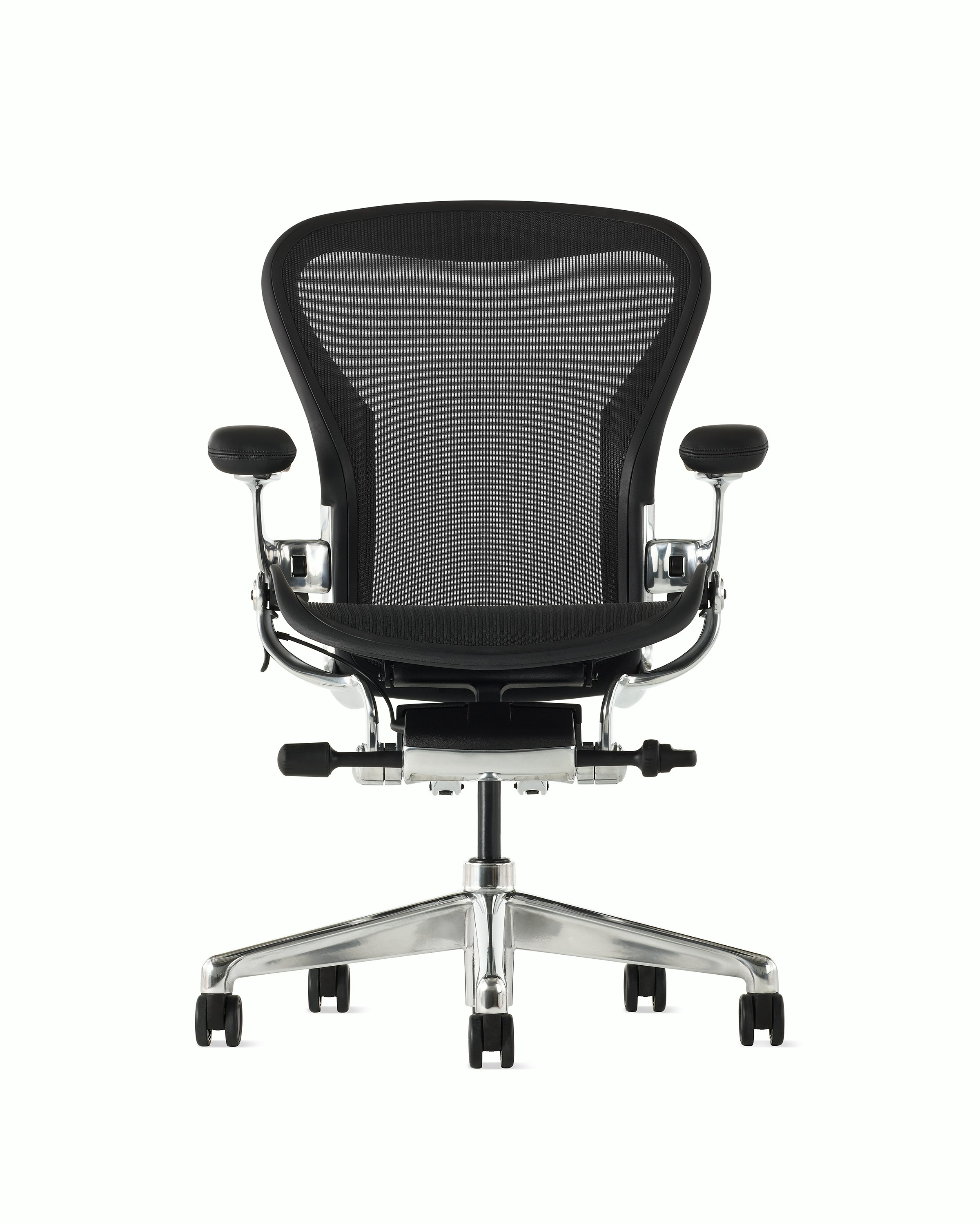 Black matte Aeron Chair on a white background with a polished aluminum 5-star base, chassis, and ergonomic back support, view of chair back.