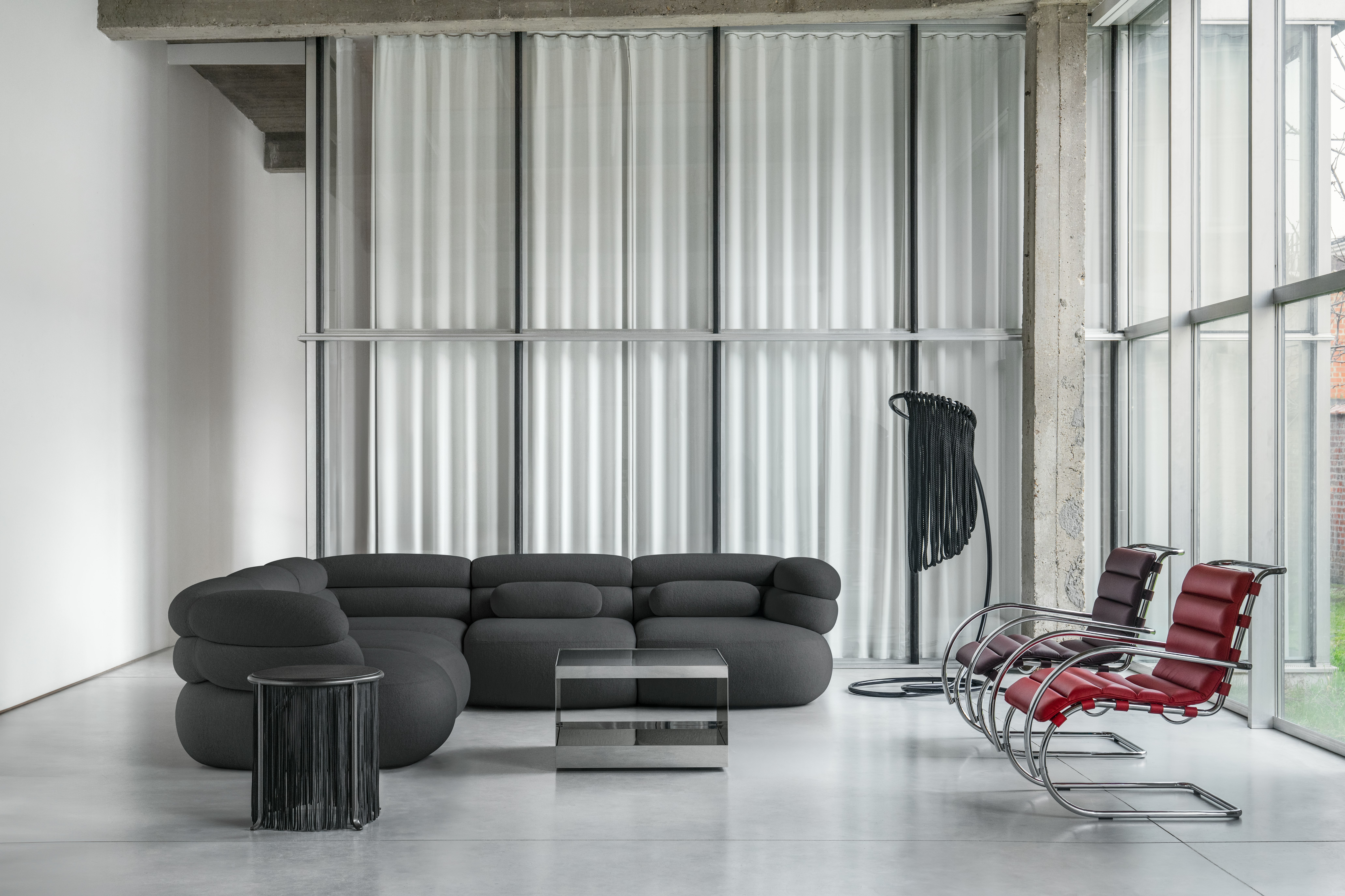 Biboni Sofa with Lumbar Pillows, Mr Armachair and D'Urso table