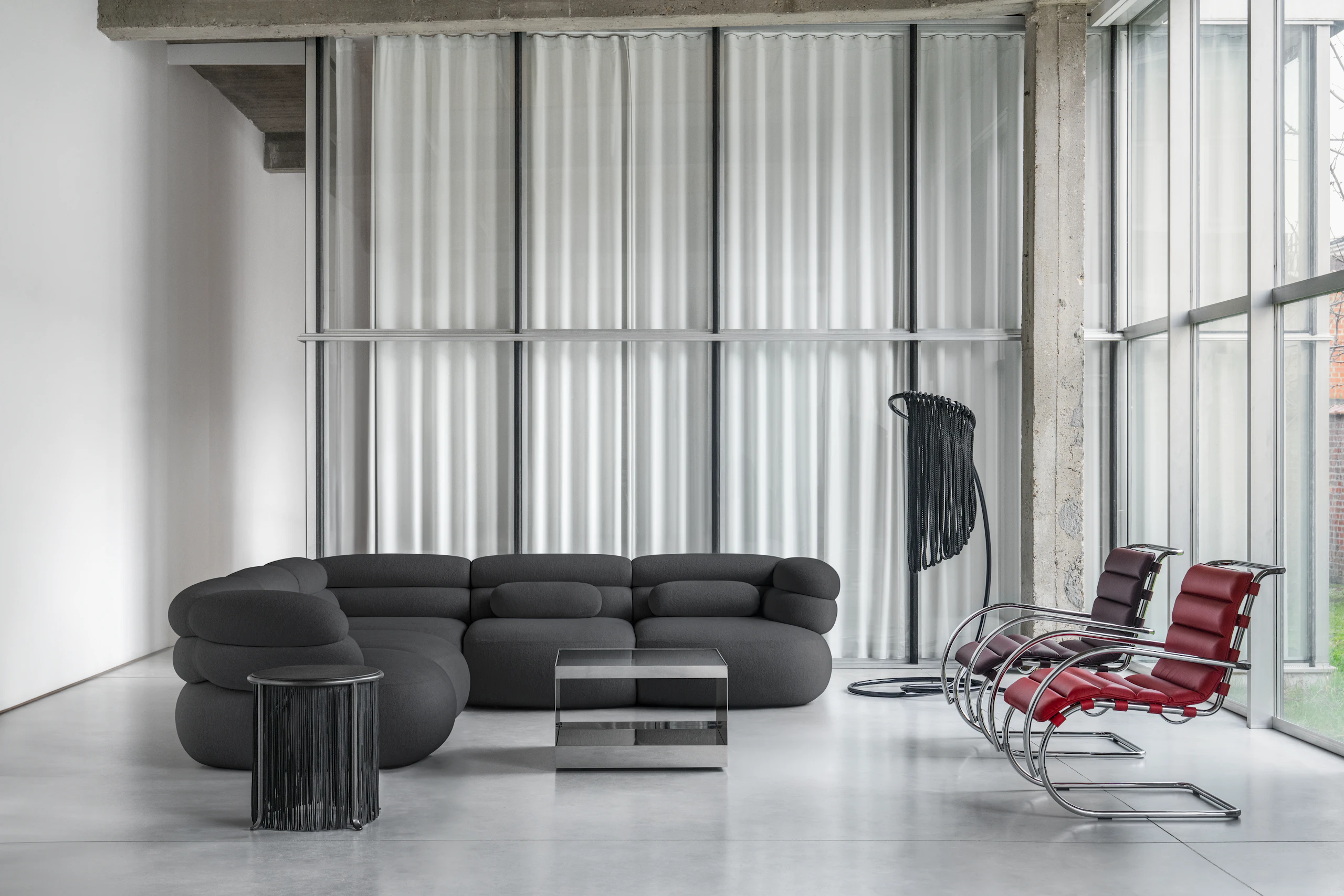 Biboni Sofa with Lumbar Pillows, Mr Armachair and D'Urso table