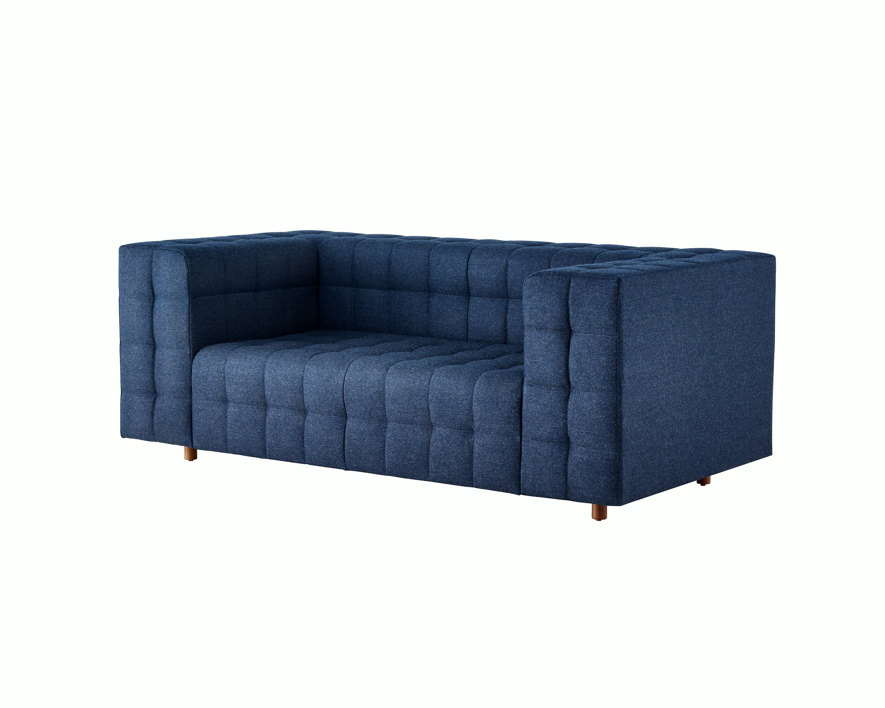 A two-seat Rapport Sofa in a deep navy colored textile, viewed at an angle.