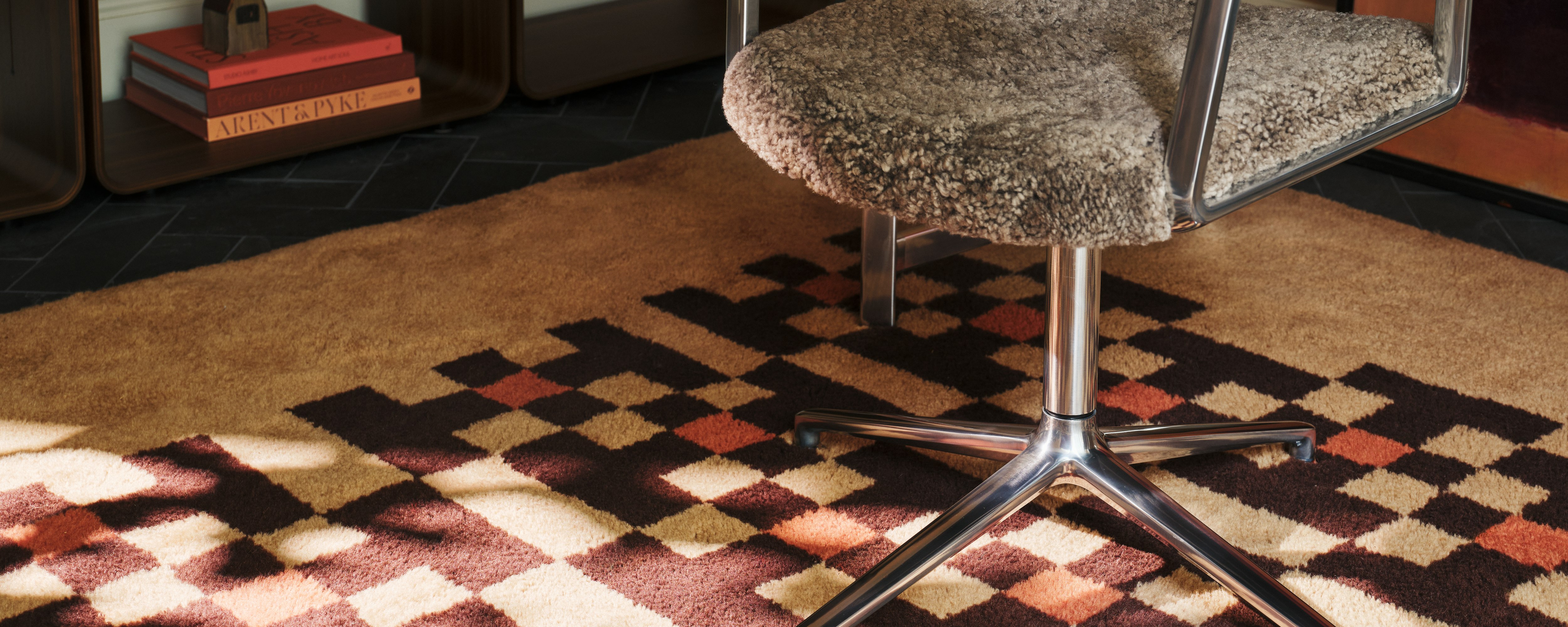 Vipp452 Swivel Chair in Curly and polished frame in a home office