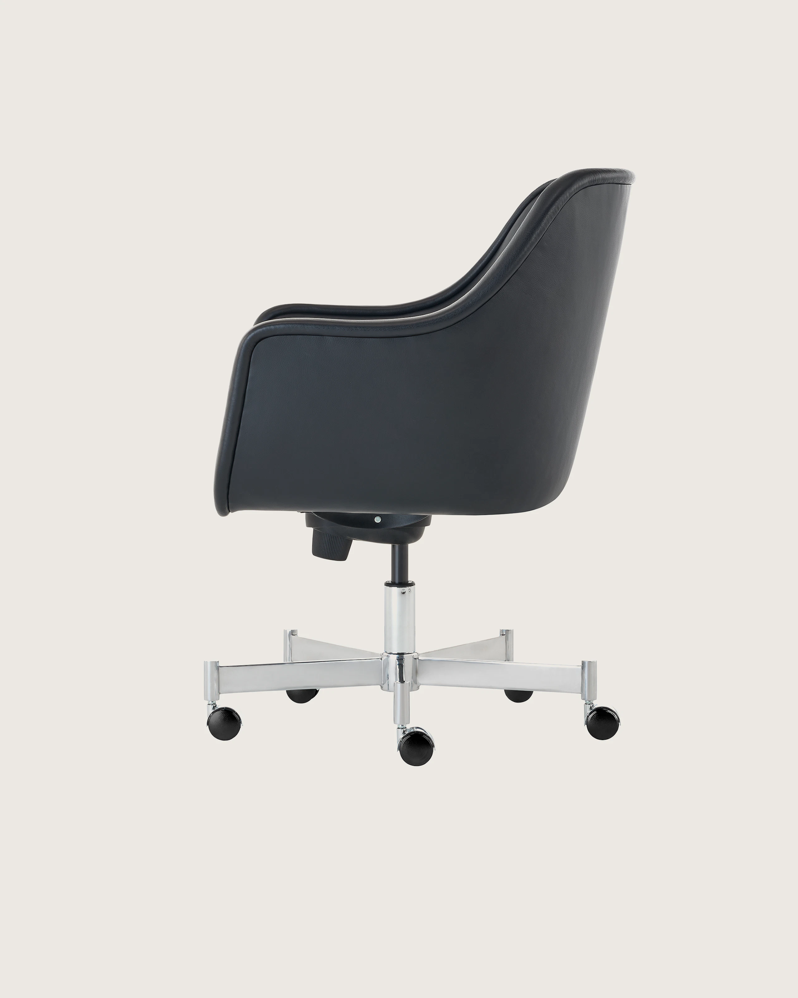 Bumper Chair with standard arms and five star base with casters, side view.