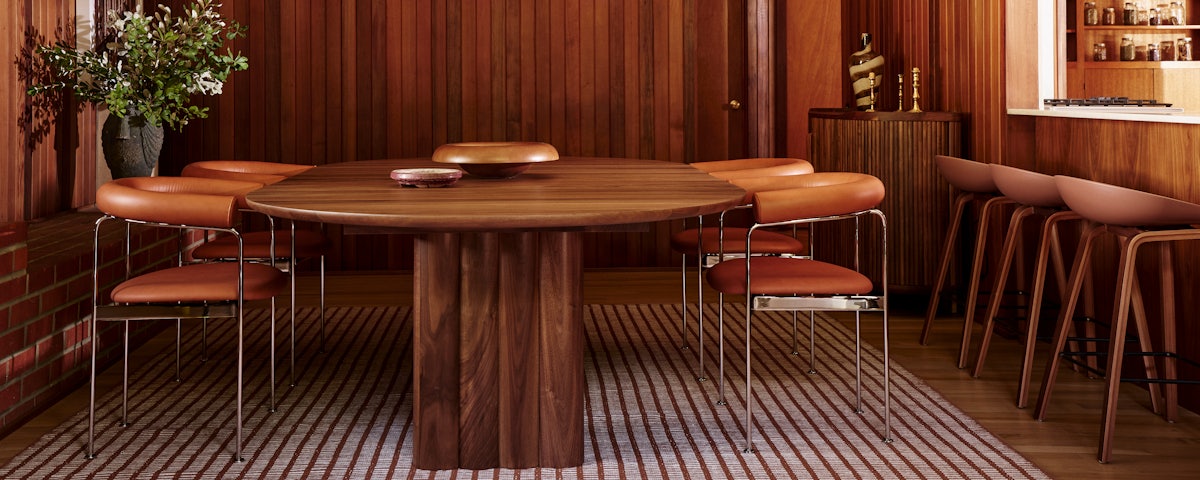 Plush Extension Dining Table surrounded by Baia Dining Chairs in a dining room ressetin