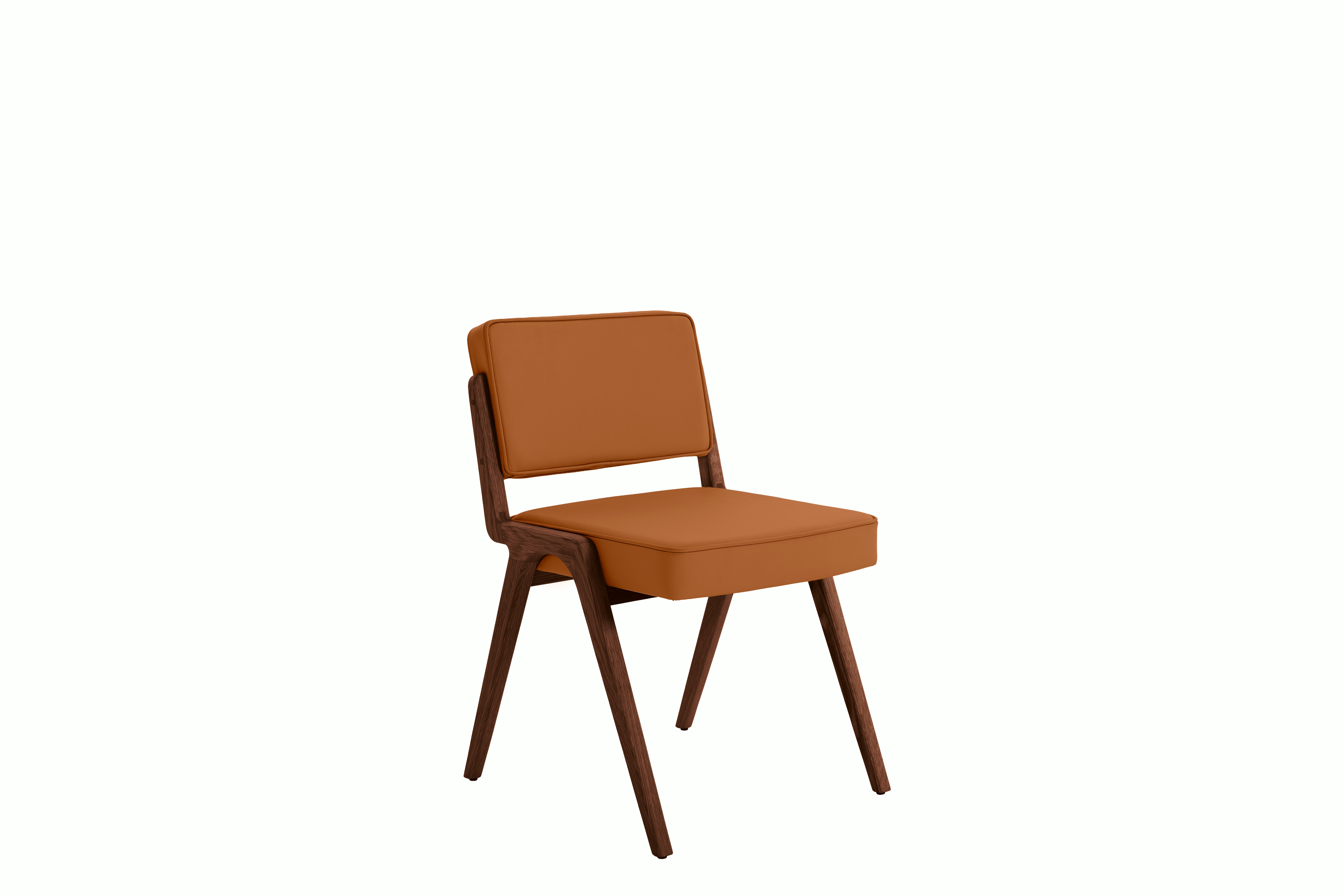 A Eugenio Dining Chair in cognac viewed from an angle.