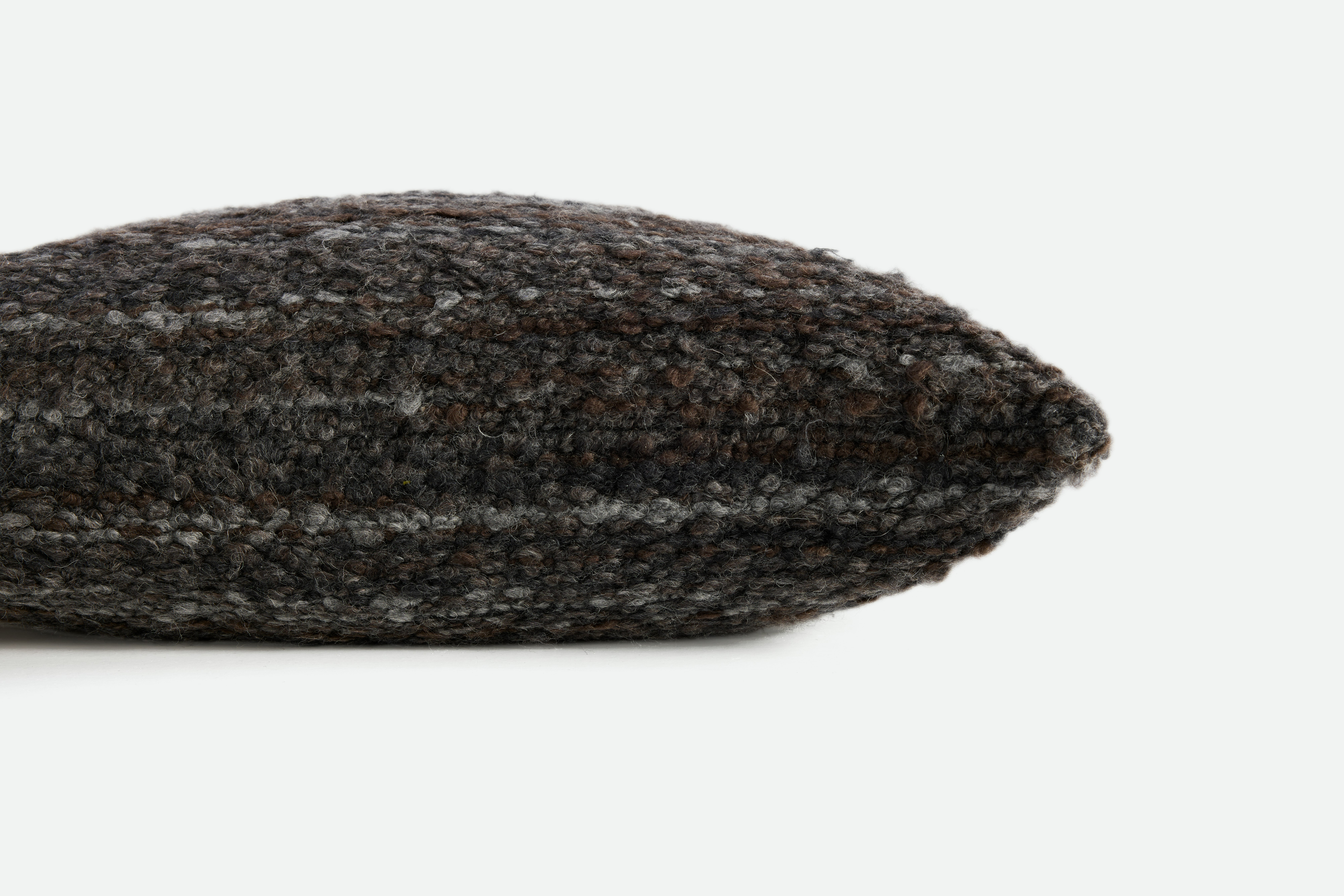 A detailed look at a Holly Hunt Winnie Pillow in Caviar.