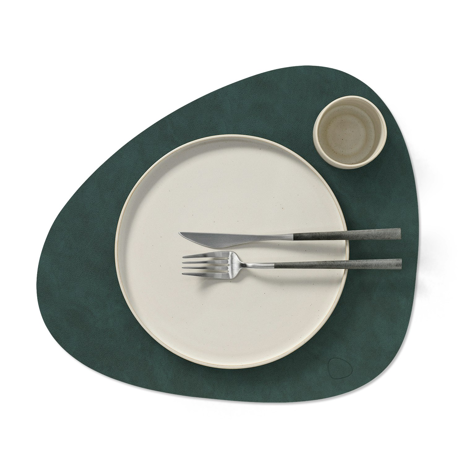A detailed look at Curve Placemat in dark green.