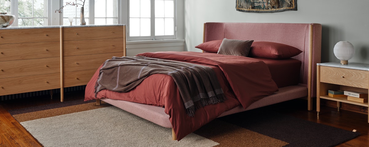 Tegel Rug under a bed in a bedroom setting