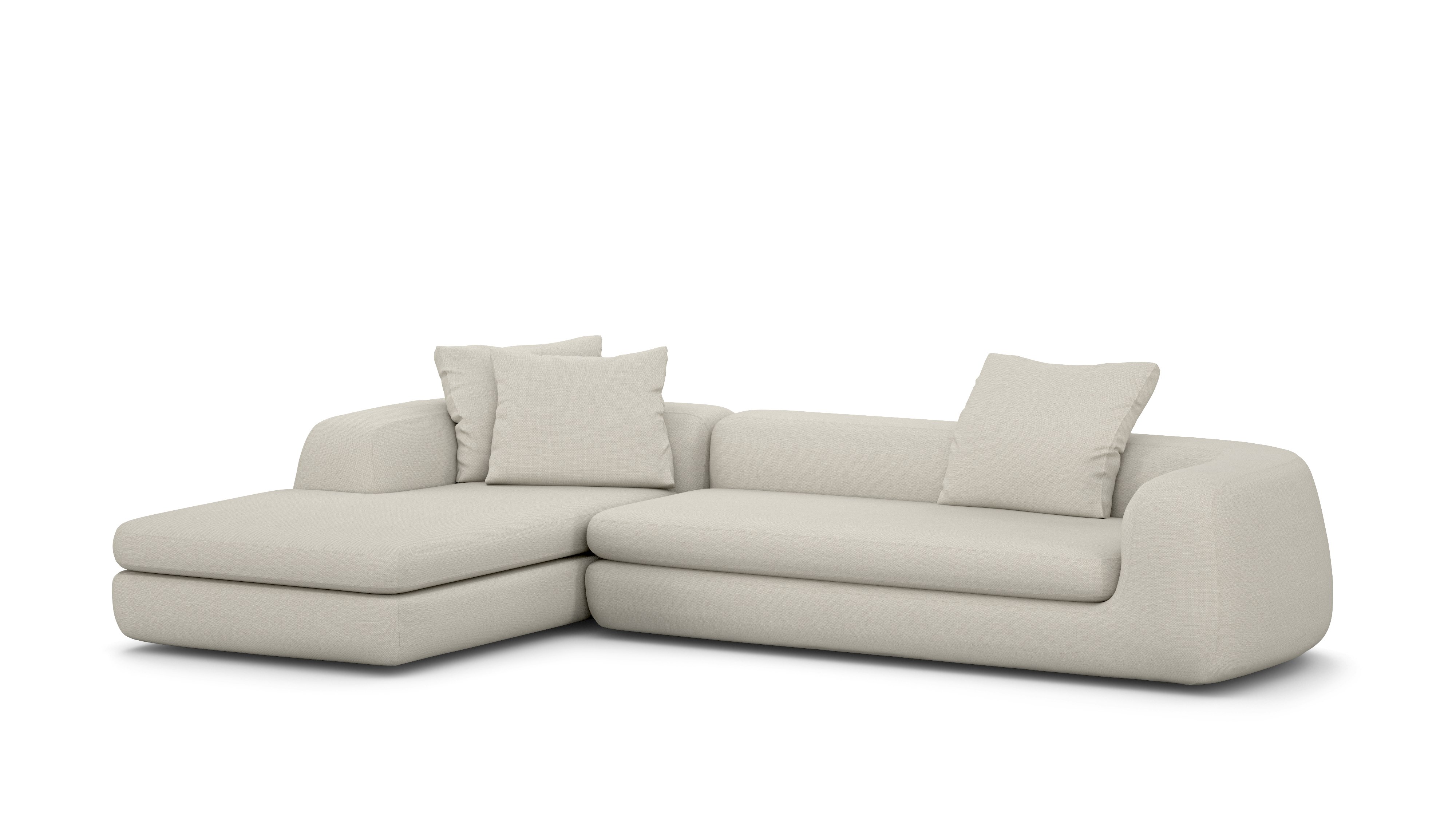 A Atlason Americano Chaise Sectional in Mode Shell viewed from an angle.
