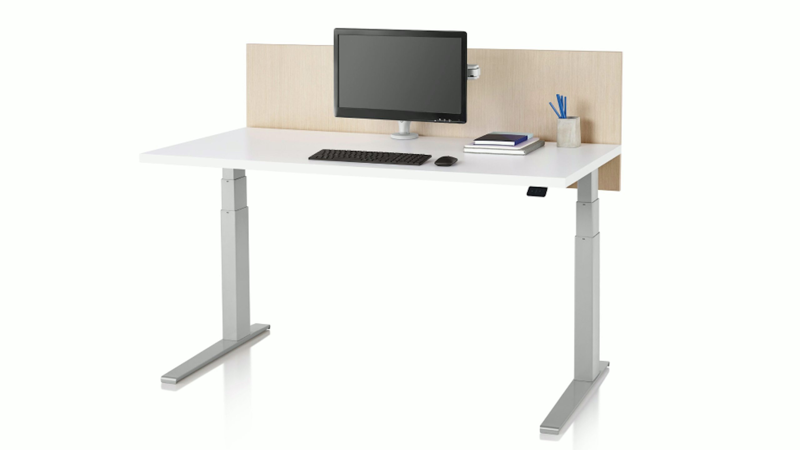 A white and silver Motia Sit-to-Stand table from Herman Miller
