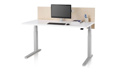 A white and silver Motia Sit-to-Stand table from Herman Miller