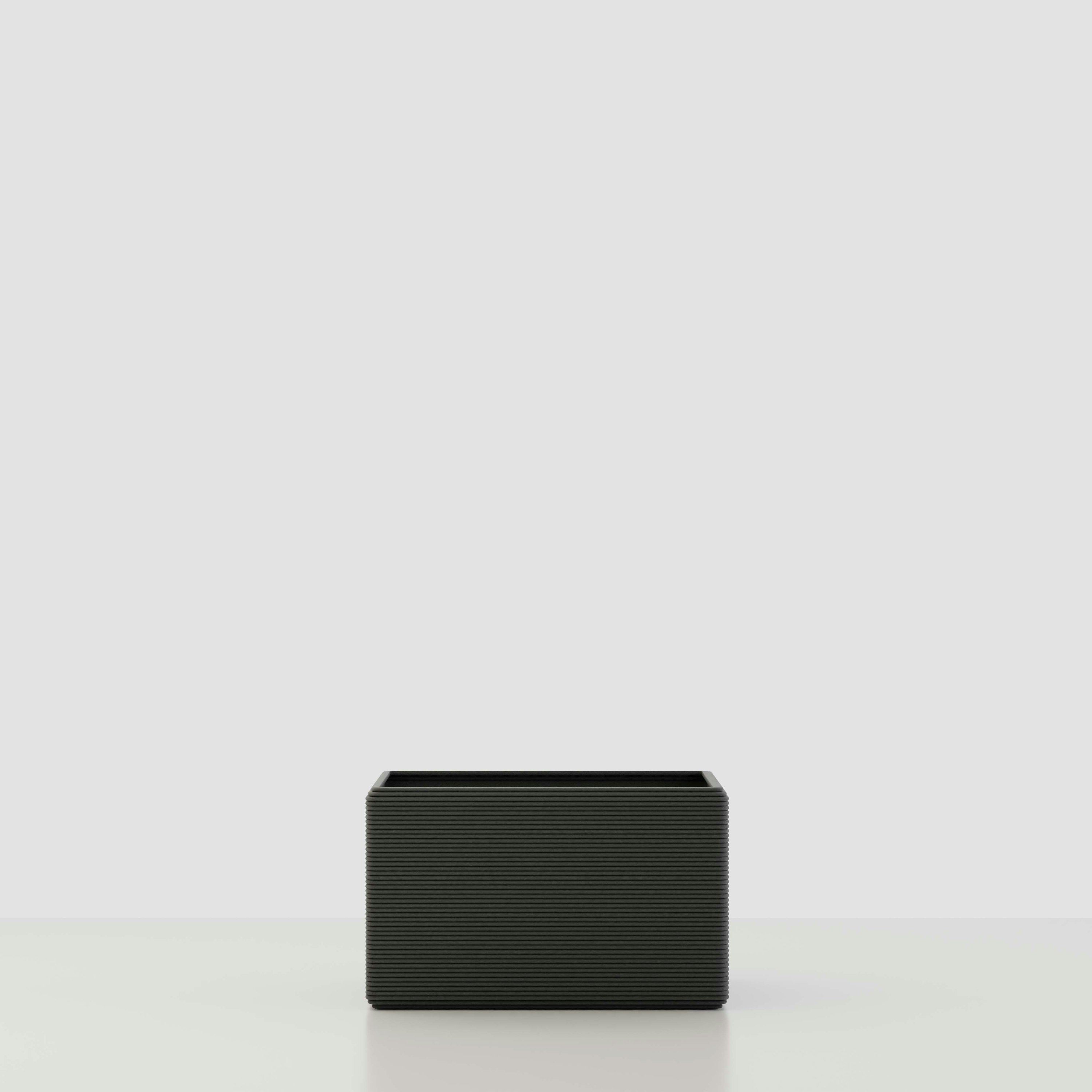 A Avila 3D Printed Concrete Planter in Obsidian Night Viewed from the front.