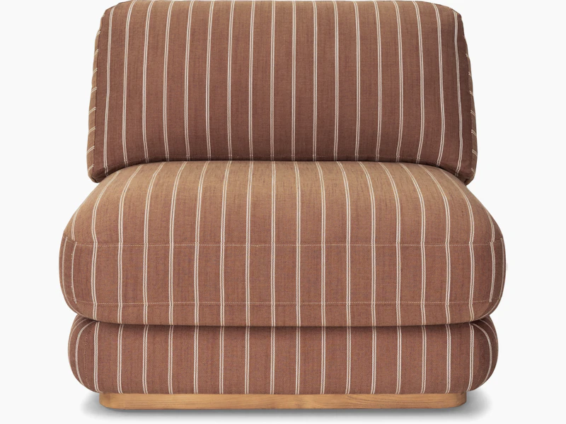 A Stack Outdoor Lounge Chair in Terra Rossa viewed from the front.