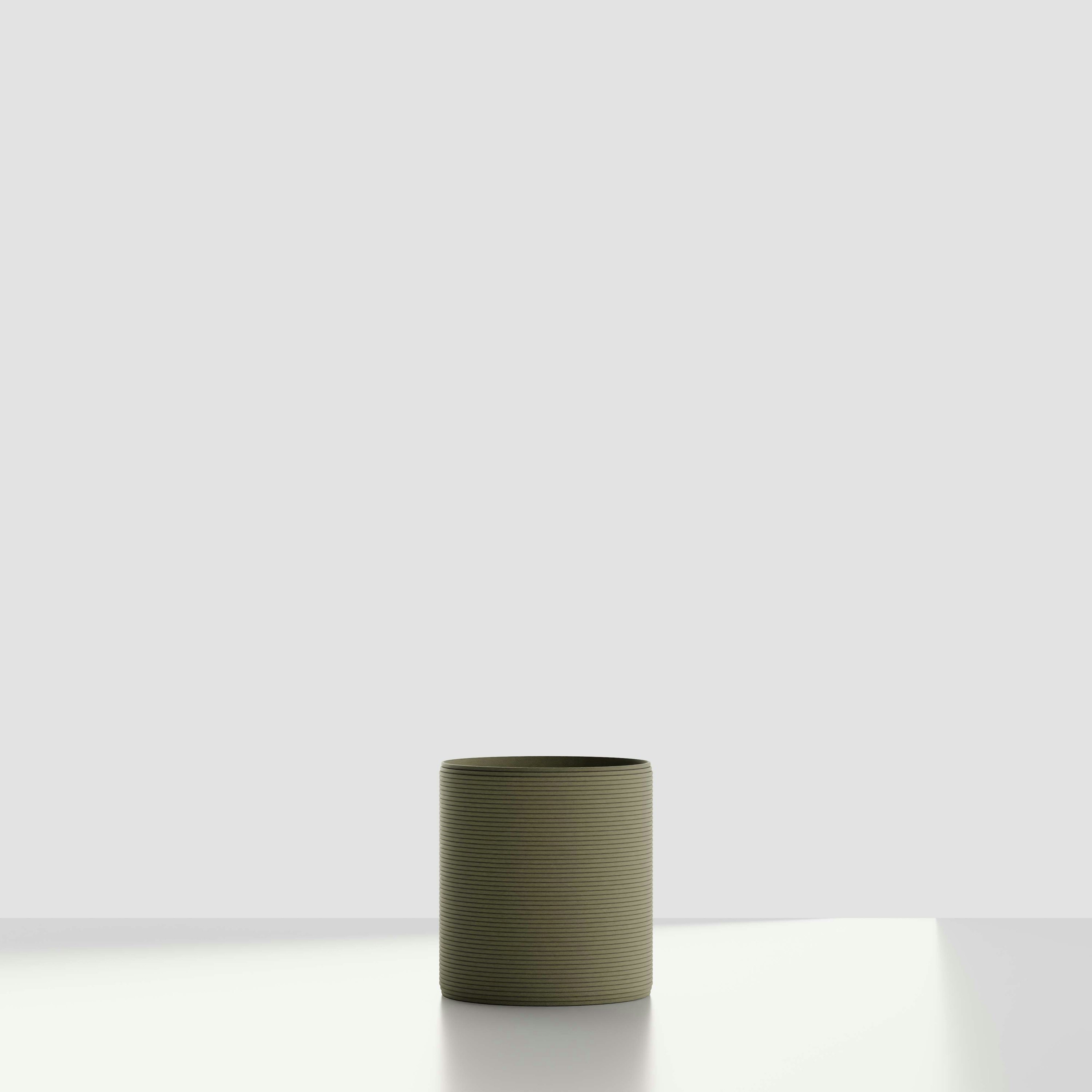 A Solana 3D Printed Concrete Planter in Mossy Glen Viewed from the front.