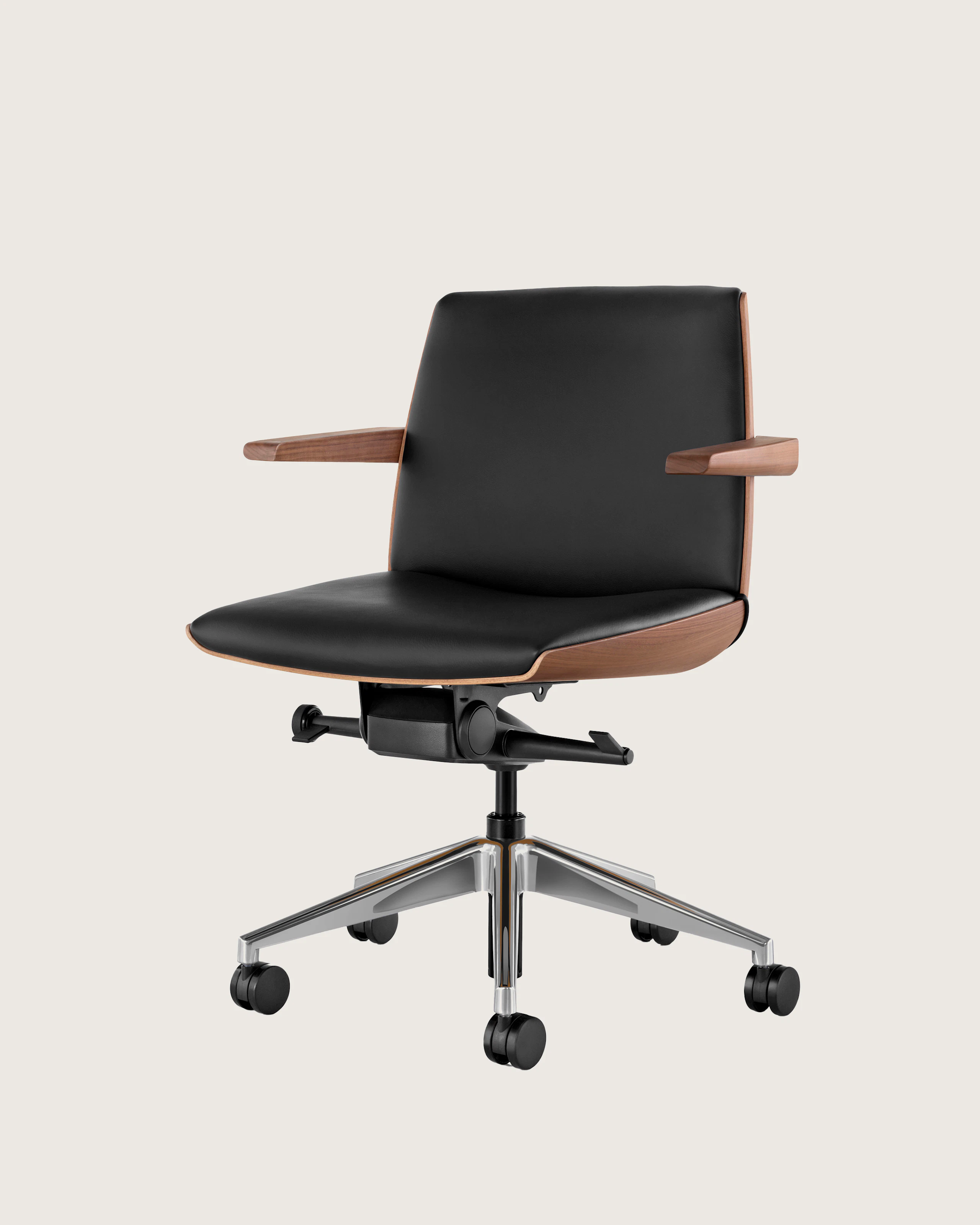 Angle view of a low-back Clamshell Conference chair with black leather upholstery, a walnut shell, with arms.