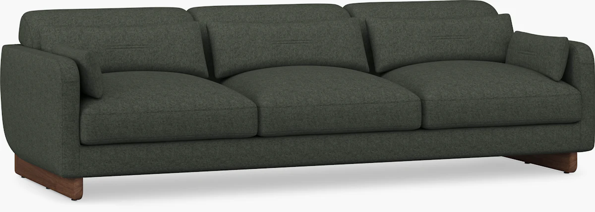 Three-seat sofa with three cushions and wooden legs