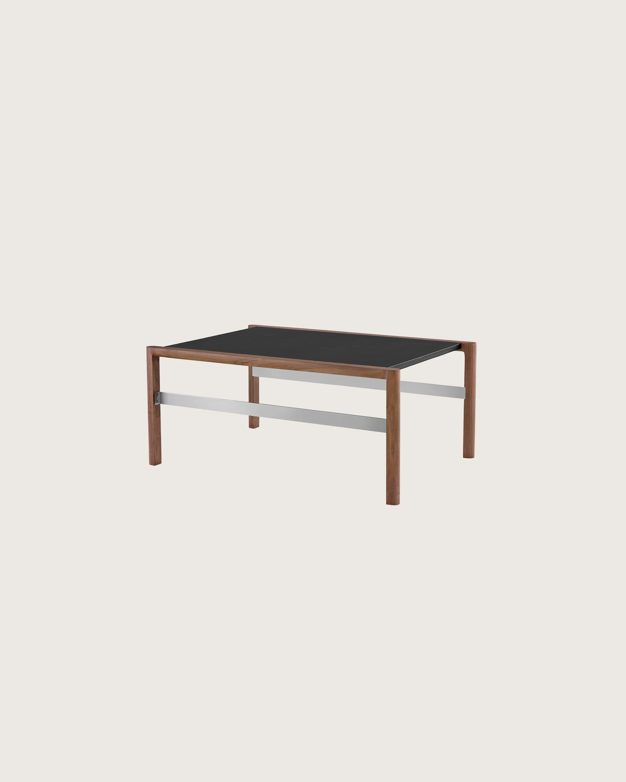 A rectangular Brabo Table with a leather-wrapped top and metal frame supports, viewed at an angle.