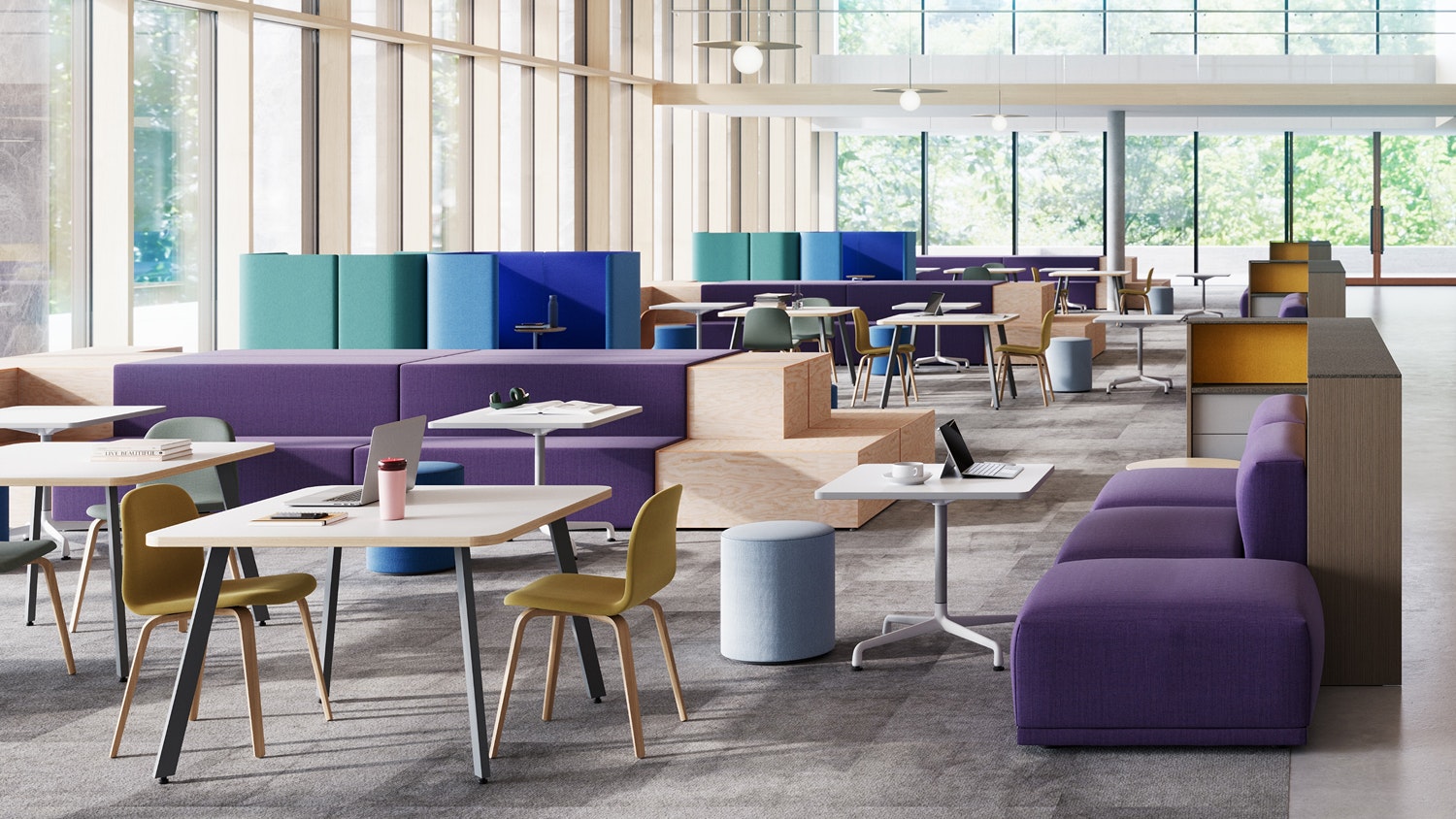 Seating area in a library/study hall furnished with purple Muuto Connect Modular Sofas, Herman Miller Eames Tables, and Muuto Viso Chairs.