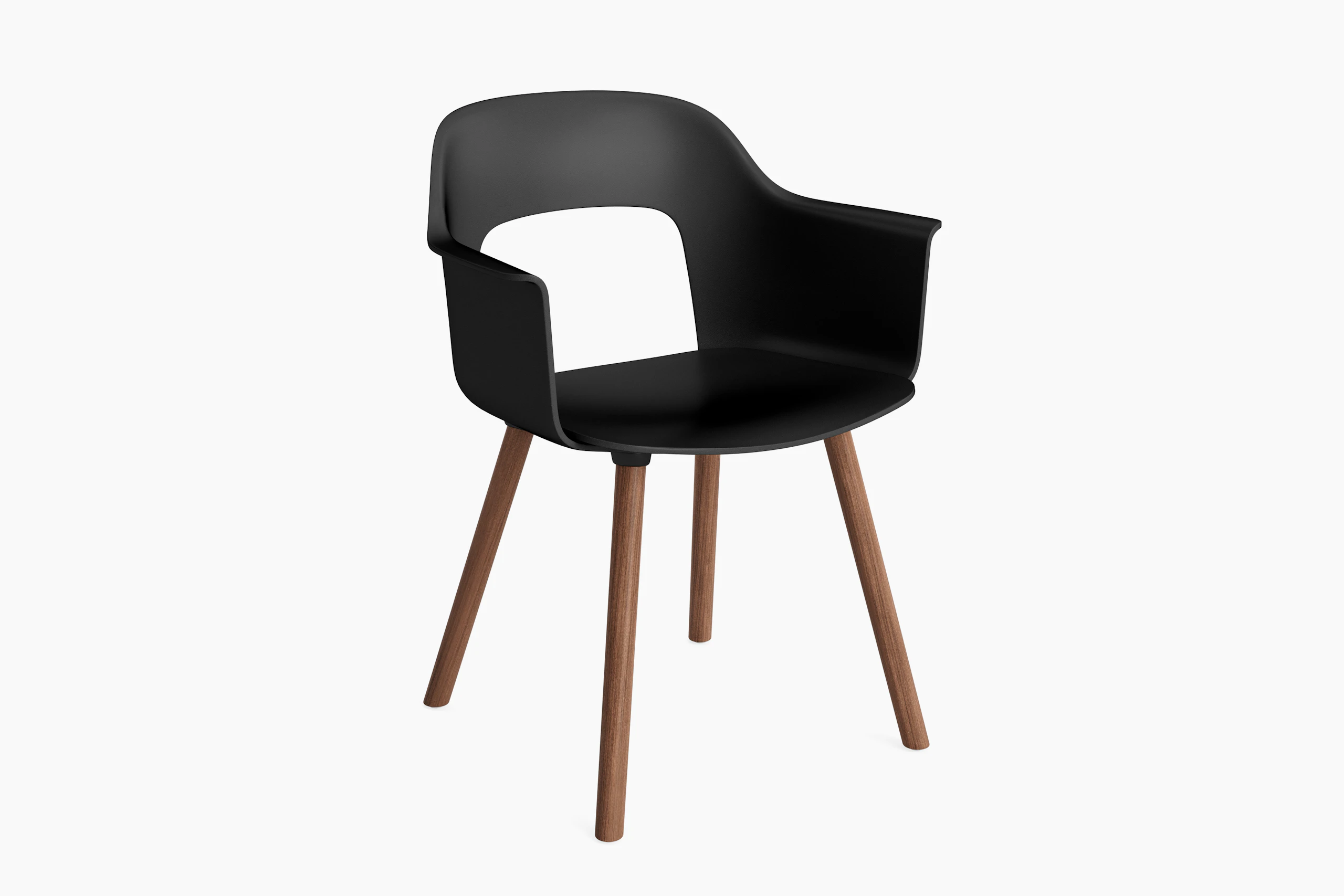 Plastic shell armchair on 4 wood legs, angled view