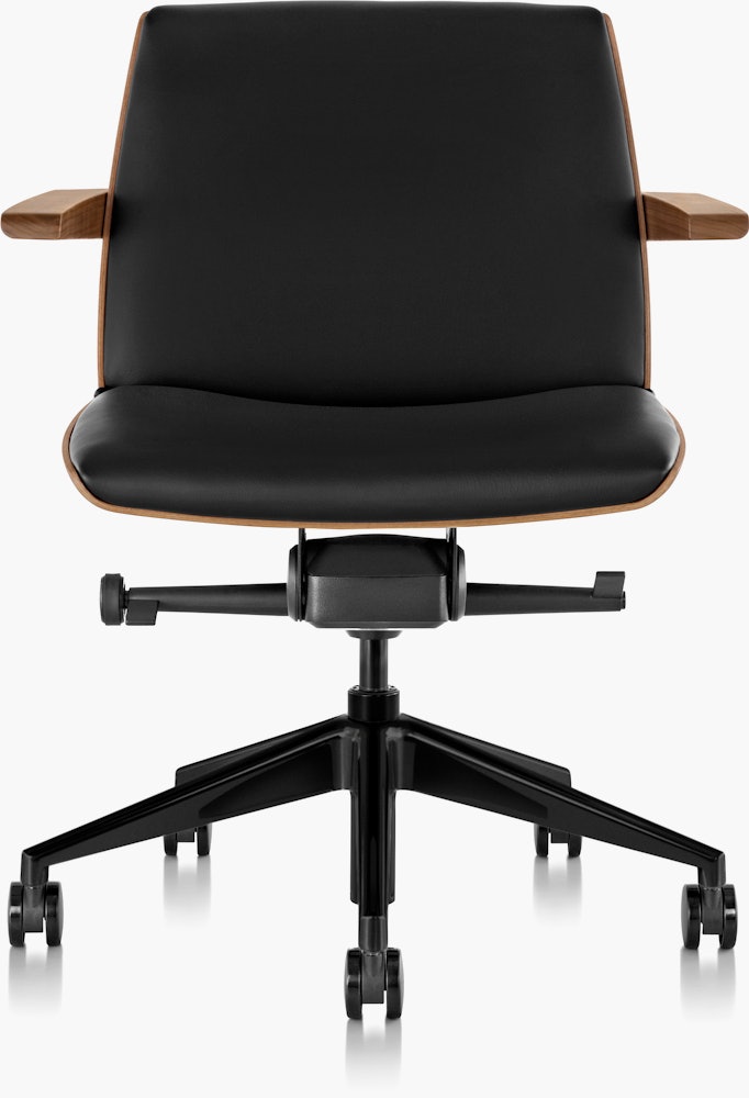 Front  view of a low-back Clamshell office chair with black leather upholstery, a walnut shell, with arms.