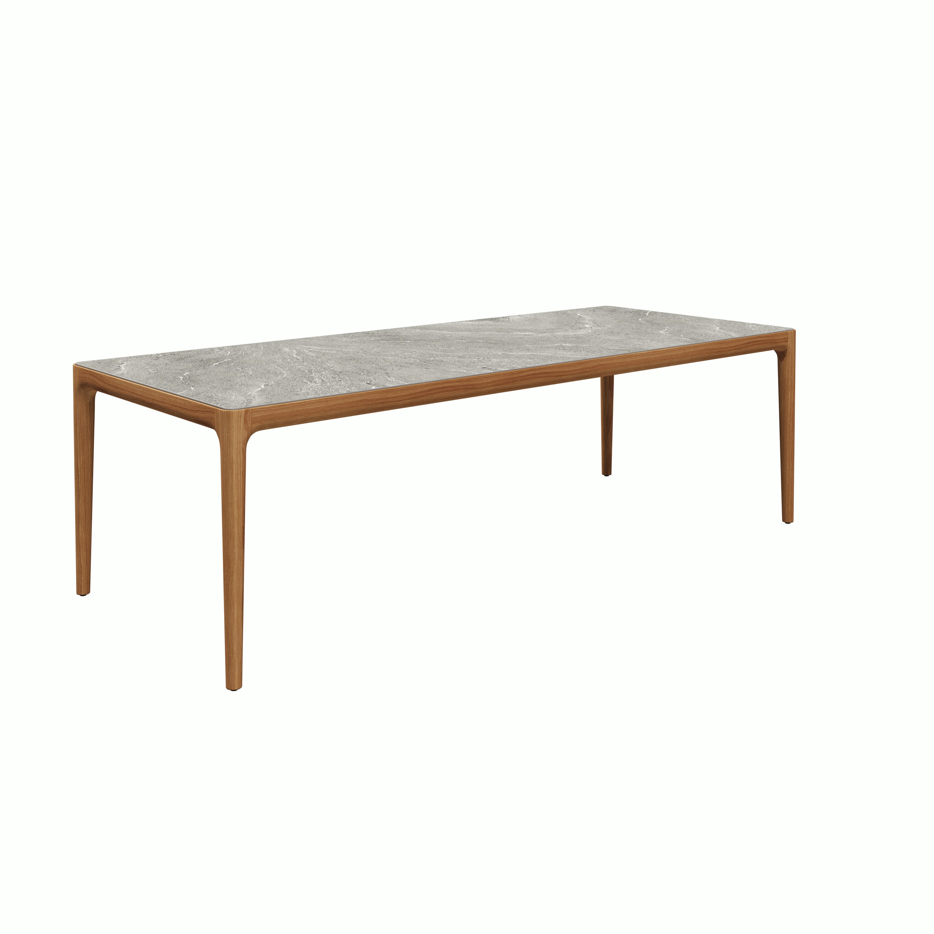 A Lima Outdoor Dining Table in Grigio Viewed from an angle.