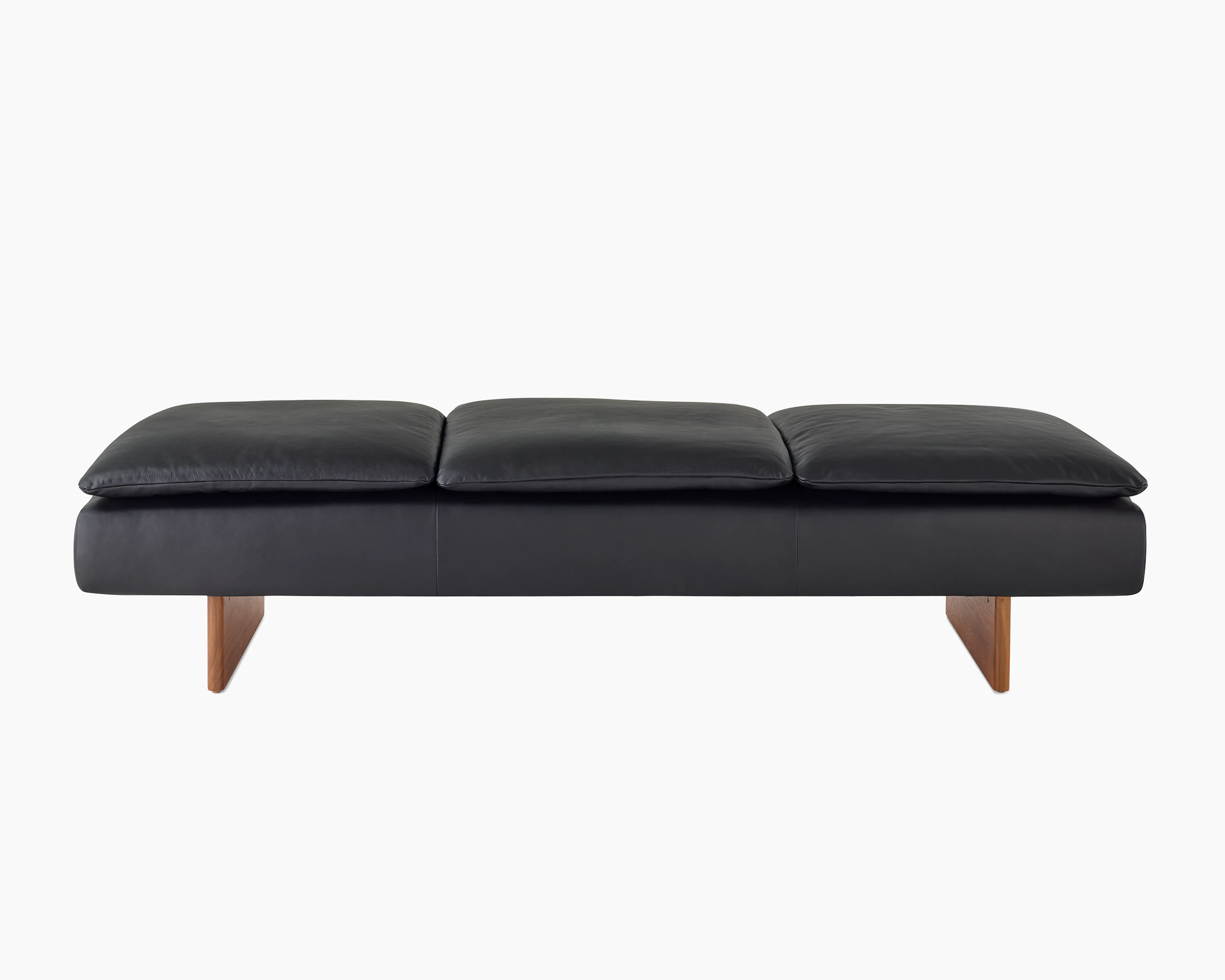 Mantle Three Seater Bench in Black Leather with a Walnut Base, viewed from the front.