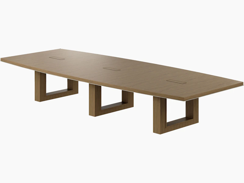 Boat-shaped Highline Fifty Conference Table in Natural Flat Cut Walnut with a Satin Nickel edge viewed from a 45 degree angle.