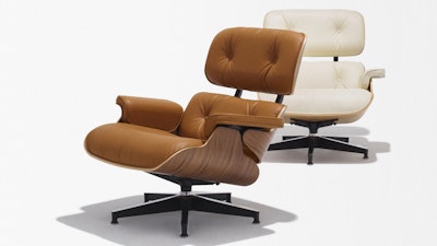 A green chair and a white chair and ottoman on a white background