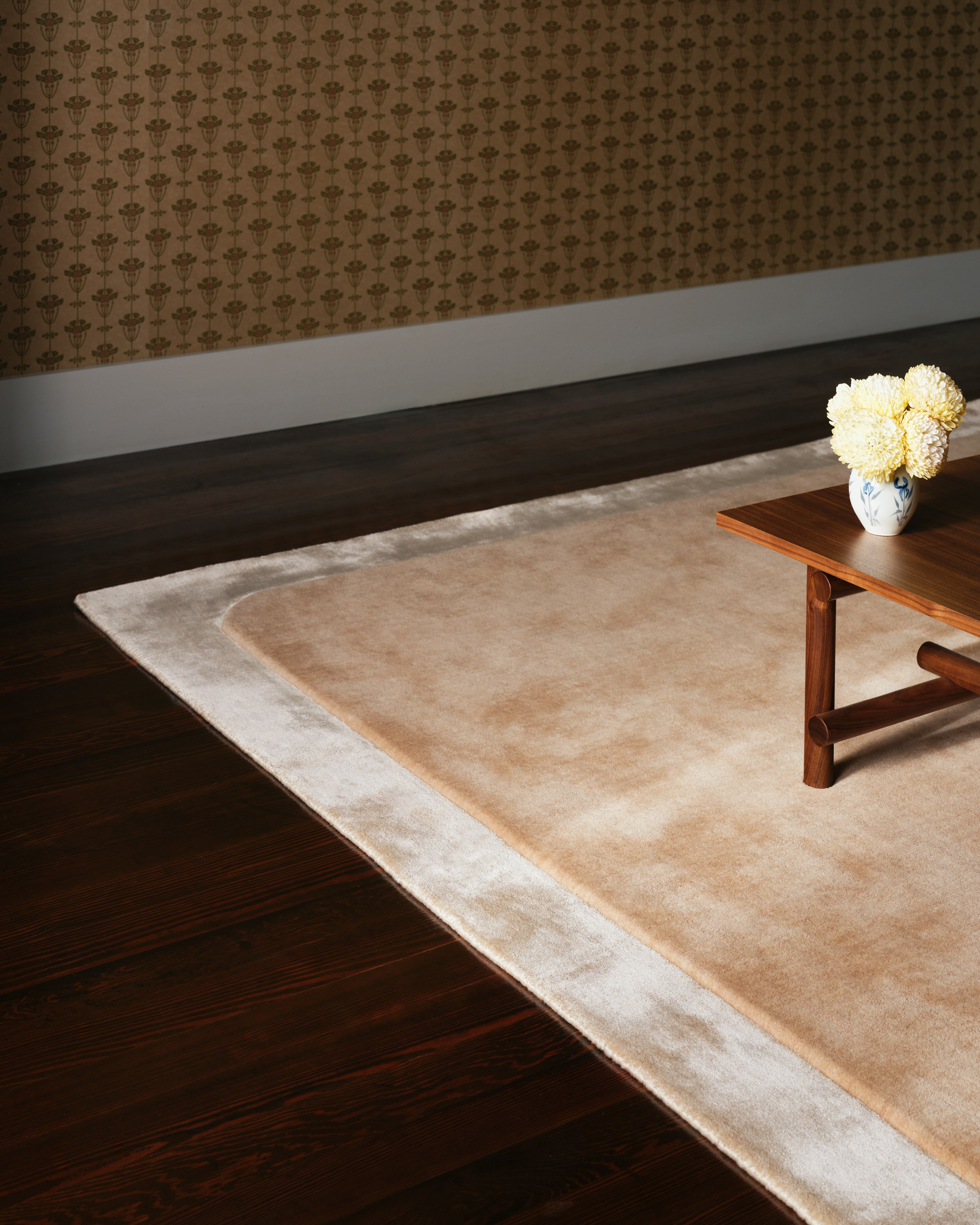 Radius Inverse Rug in Latte under a coffee table