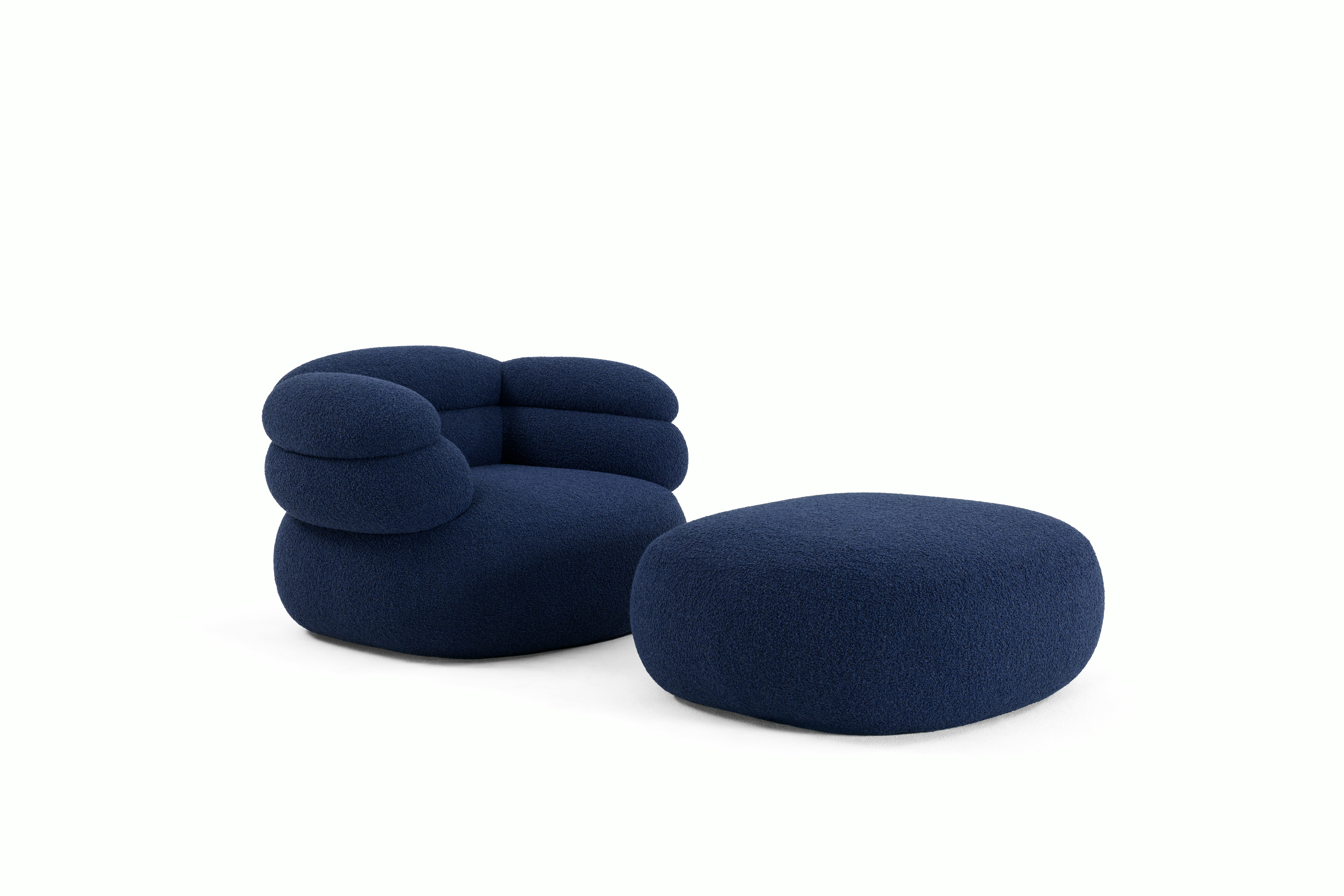 A Biboni Armchair in Solid Sublime, Navy viewed from an angle.