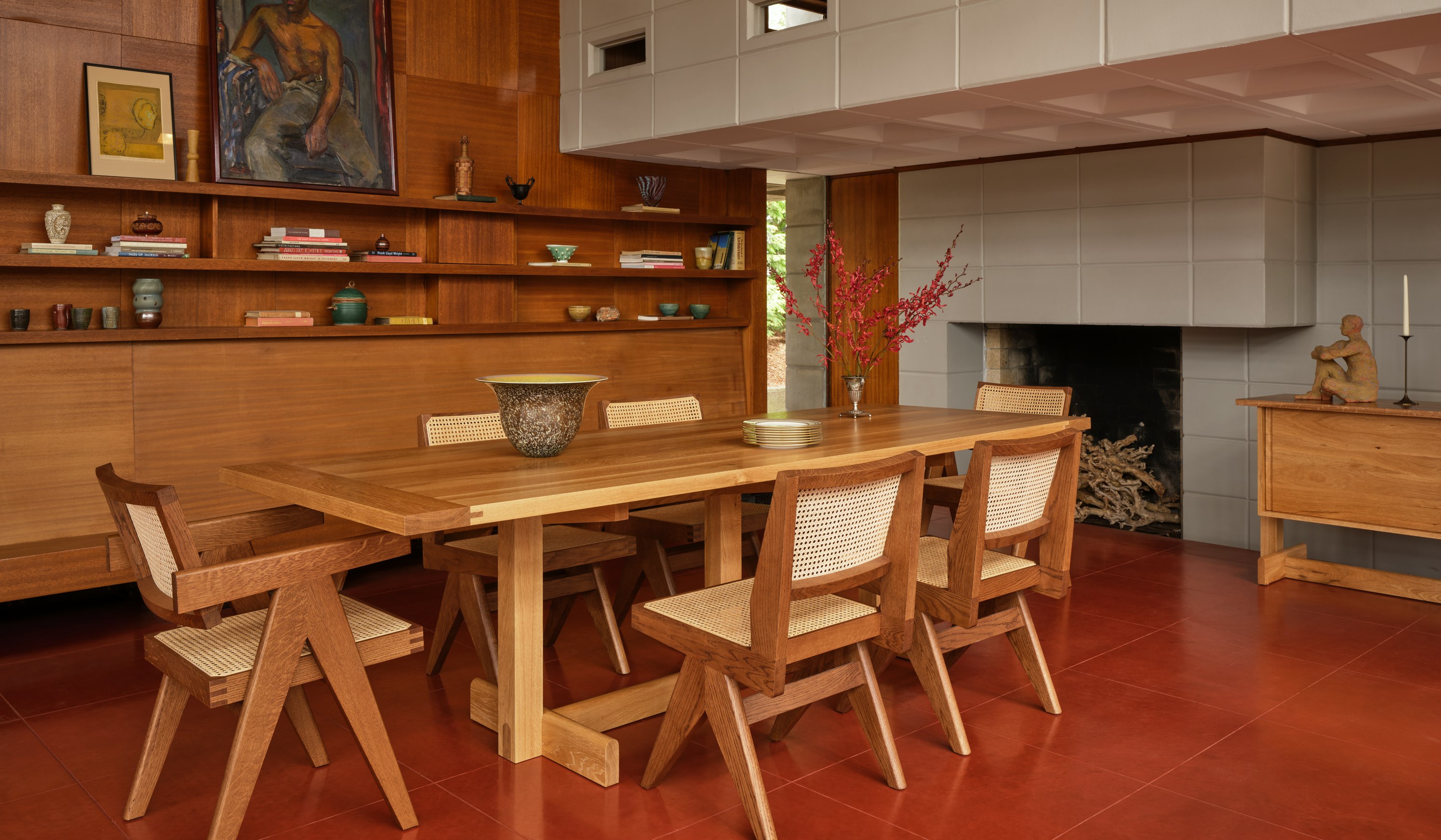 Land Dining Table surrounding by dining chairs in a dining room setting