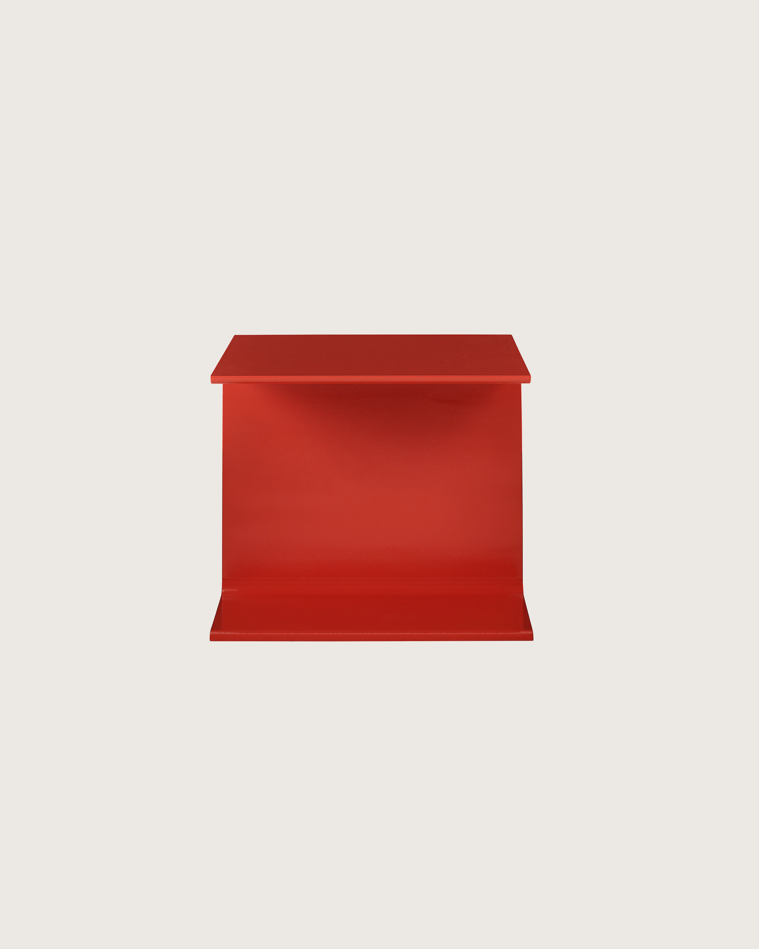I Beam Side Table designed by Ward Bennett in International Orange, shown in profile on a white sweep.