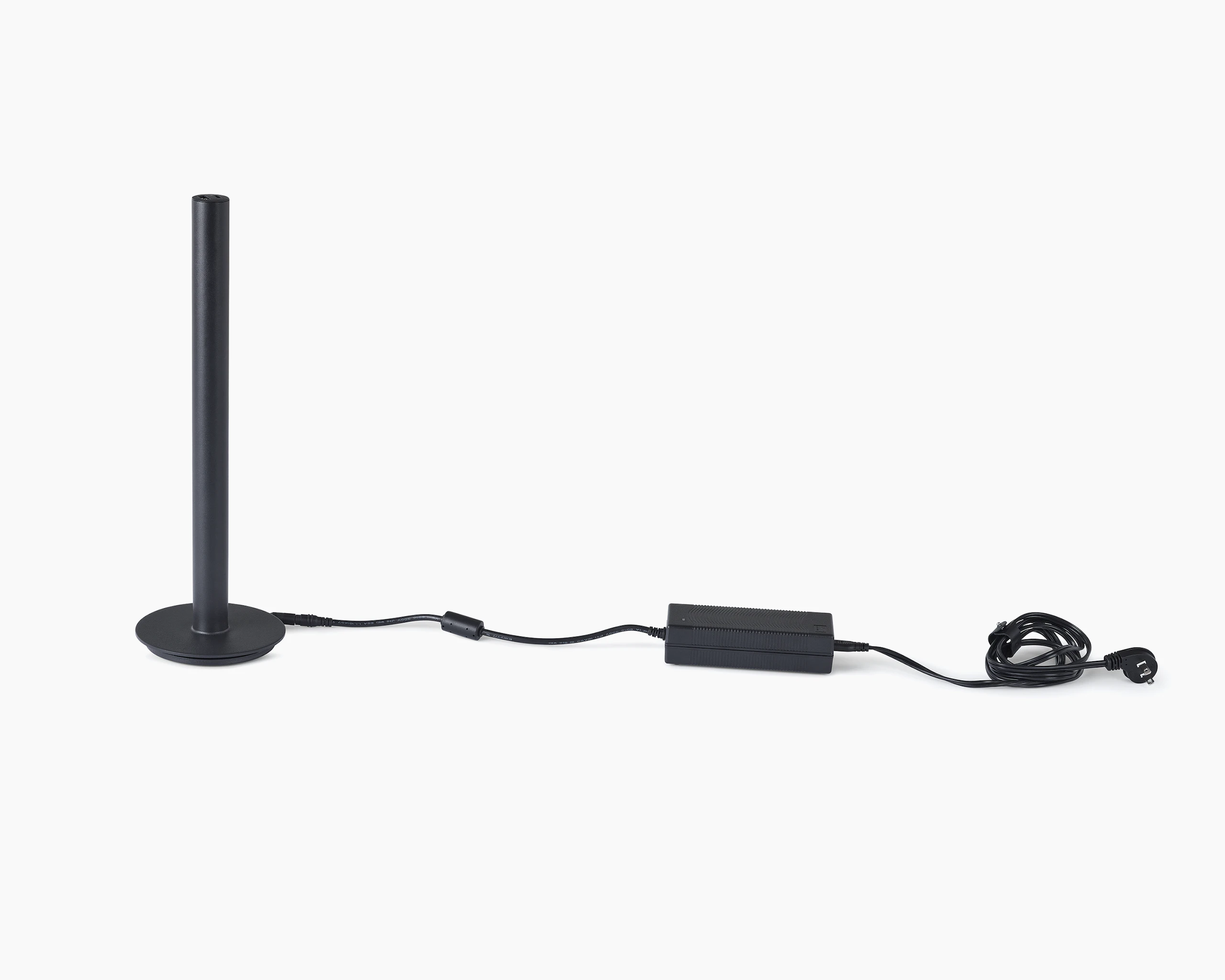 A black Logic Micro Tower with power cord.