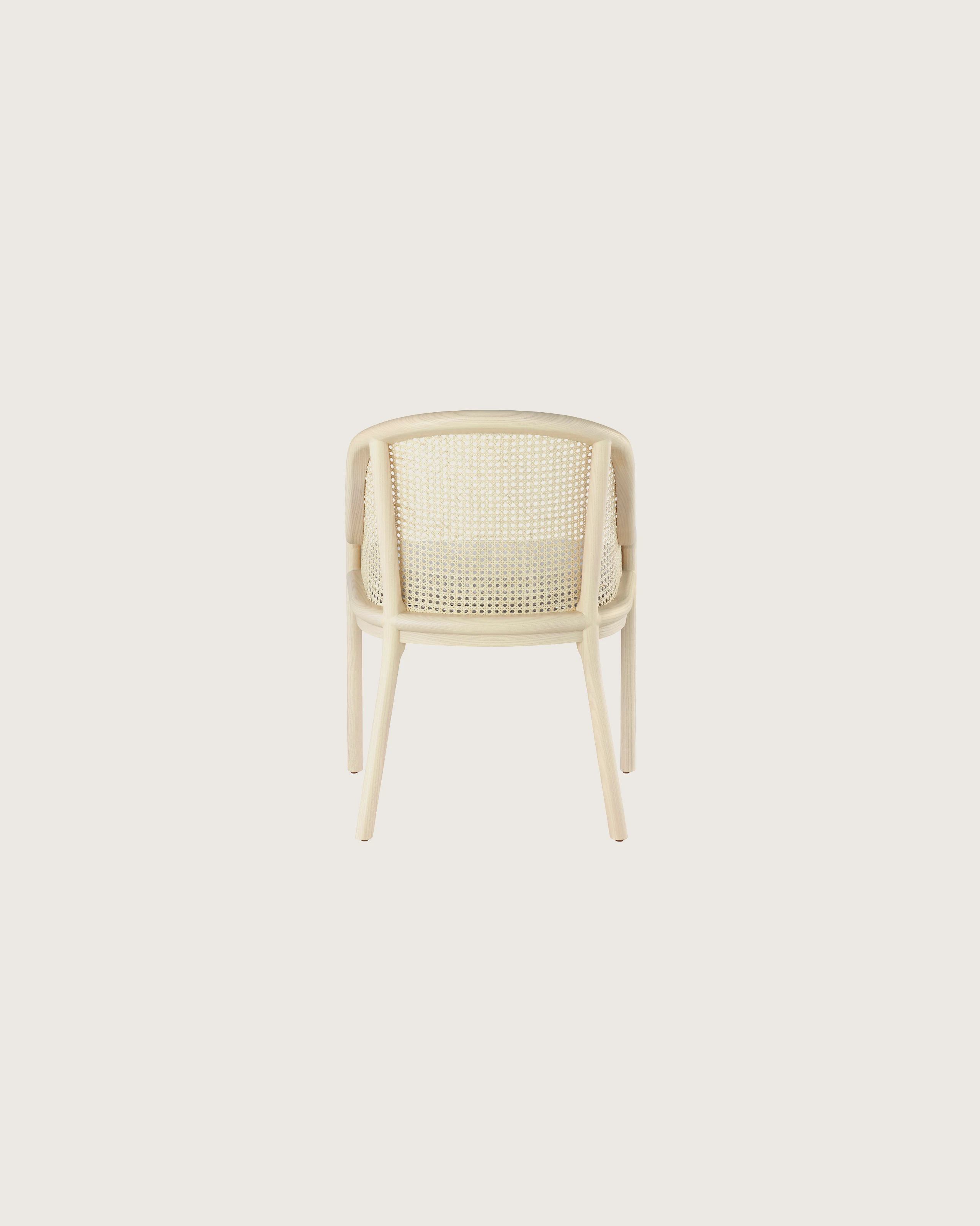 Landmark Chair with a cane back and a seat upholstered in a Double Beam textile, viewed from the back.