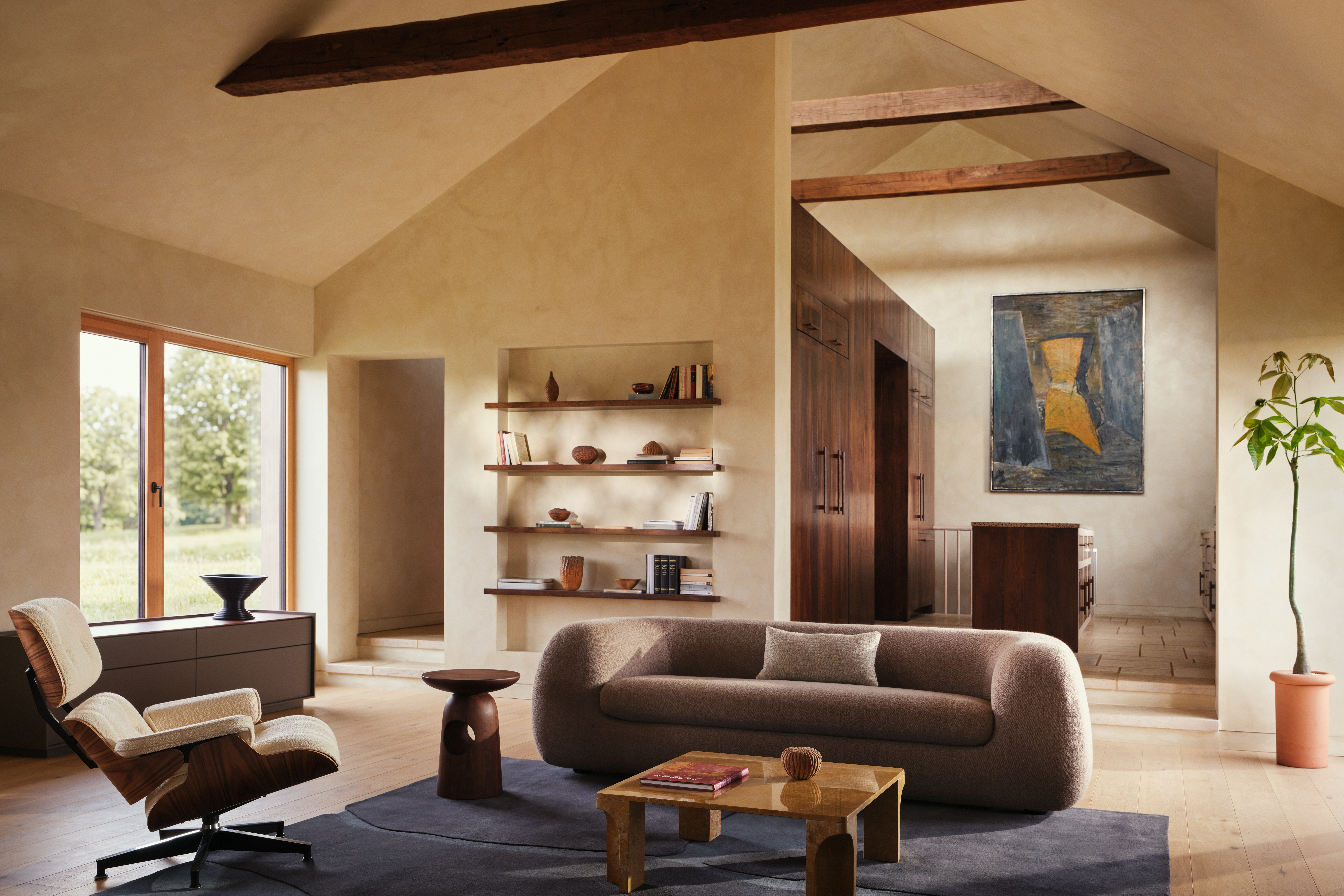 Americano Sofa in Turf Ash Brown, Doric Coffee Table and Eames Lounge  in a living room