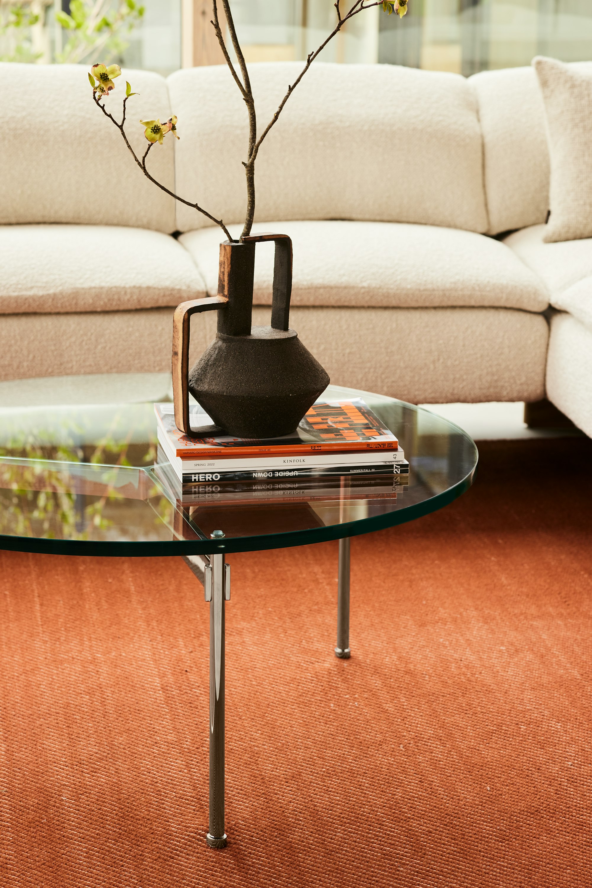 A Claw Coffee Table in a residential setting with the Mantle Sofa.