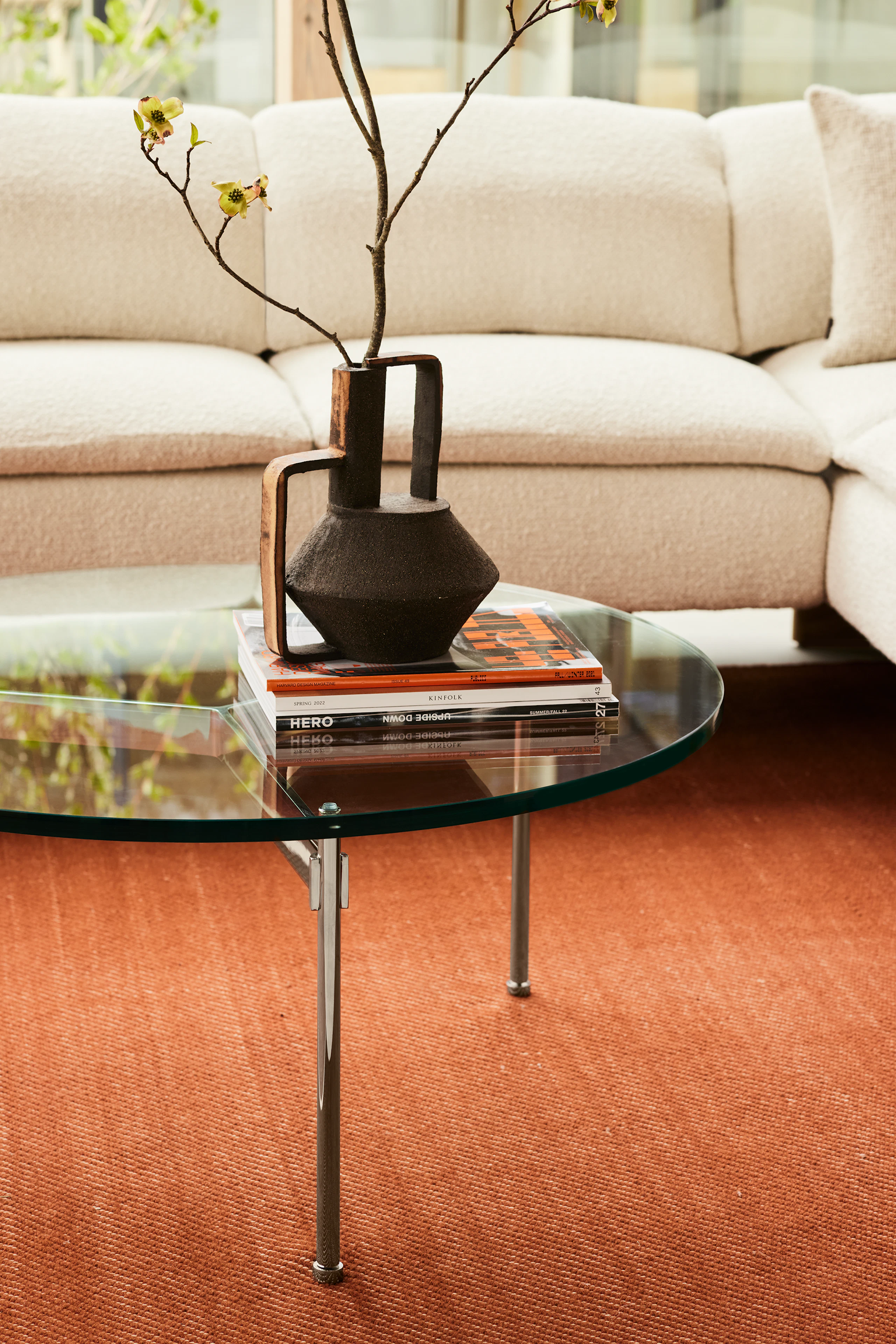 A Claw Coffee Table in a residential setting with the Mantle Sofa.