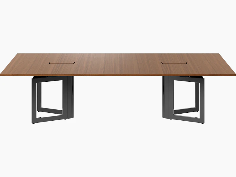 Highline Vector Conference Table in Natural Quarter Cut Walnut with a Jet Black base viewed from the front.